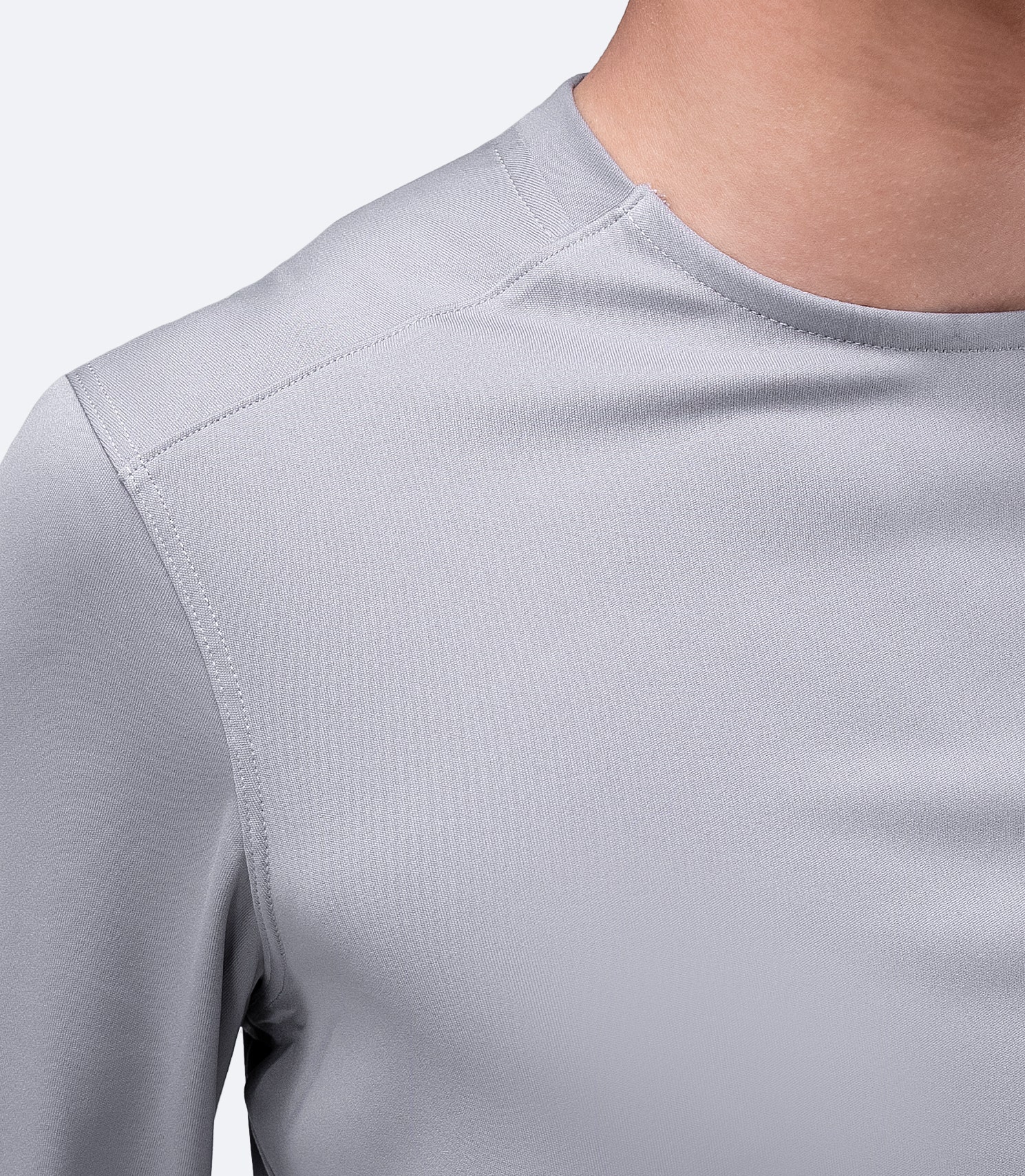 Detailed view of grey Zhik Men's UVactive Top, highlighting collar construction and breathable polyester knit.