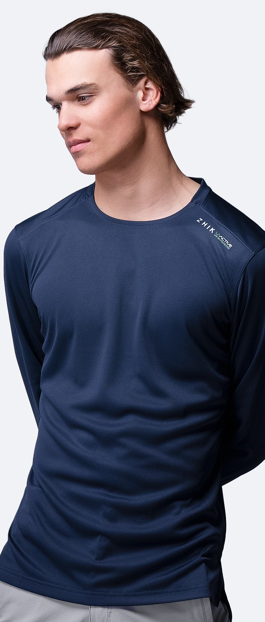 Front view of Zhik Men's UVactive Long Sleeve Top in navy, showing tapered arms and moisture-wicking performance fabric.