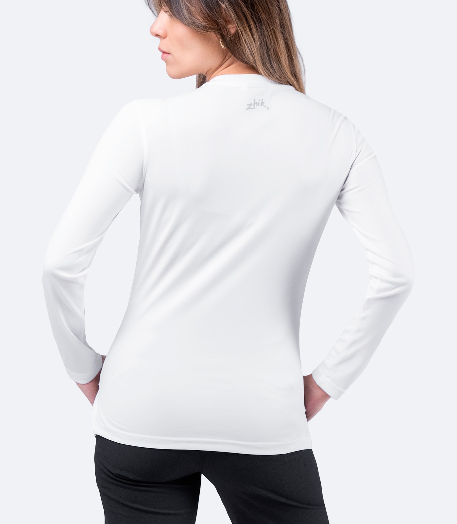 White Zhik Women's UVActive Long Sleeve Top, rear view highlighting high-gauge knit fabric, moisture control, and lightweight feel.