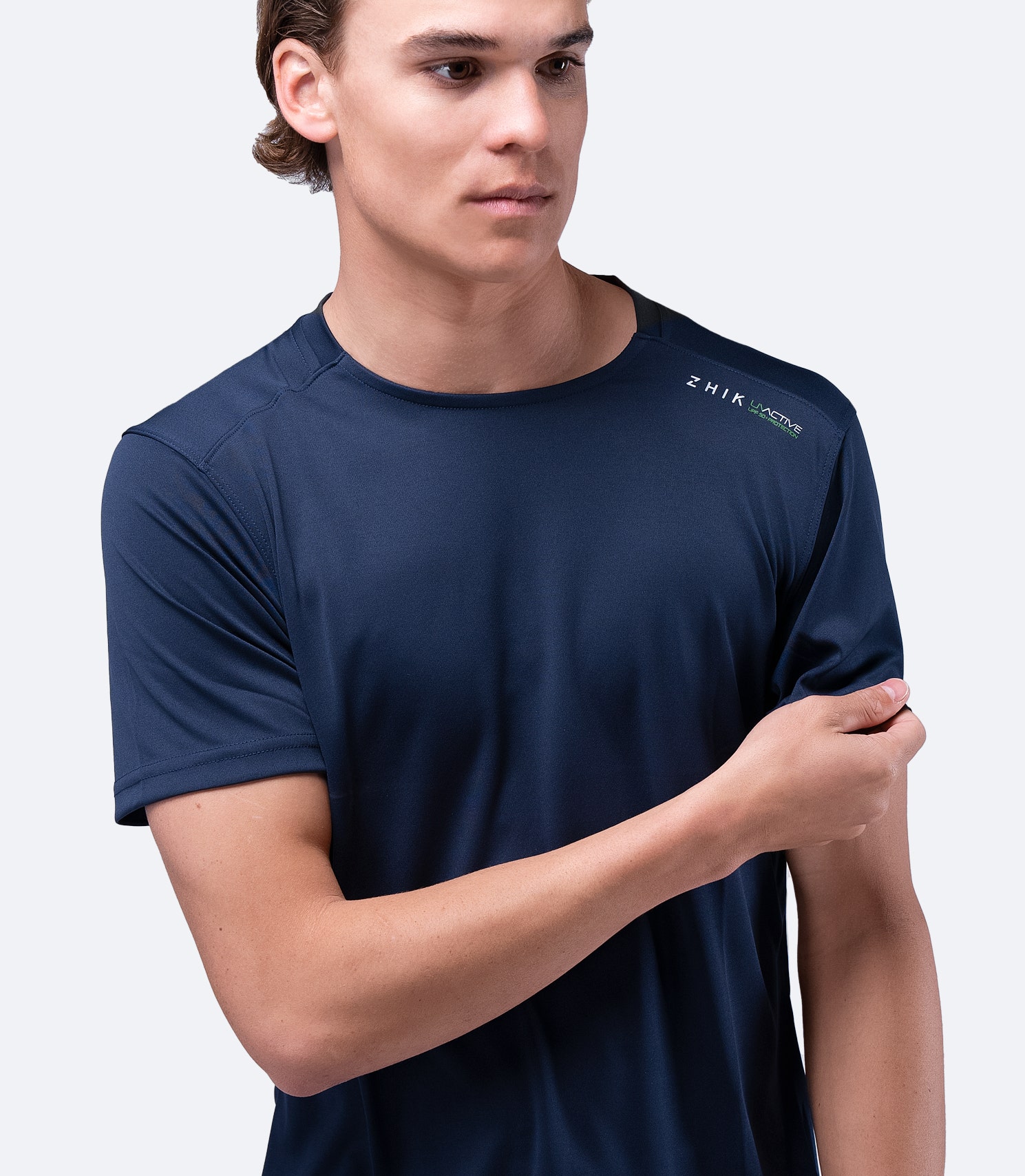 Navy Zhik Men's UVActive Short Sleeve Top sleeve detail, showing smooth, snag-resistant fabric and reinforced seams for durability.