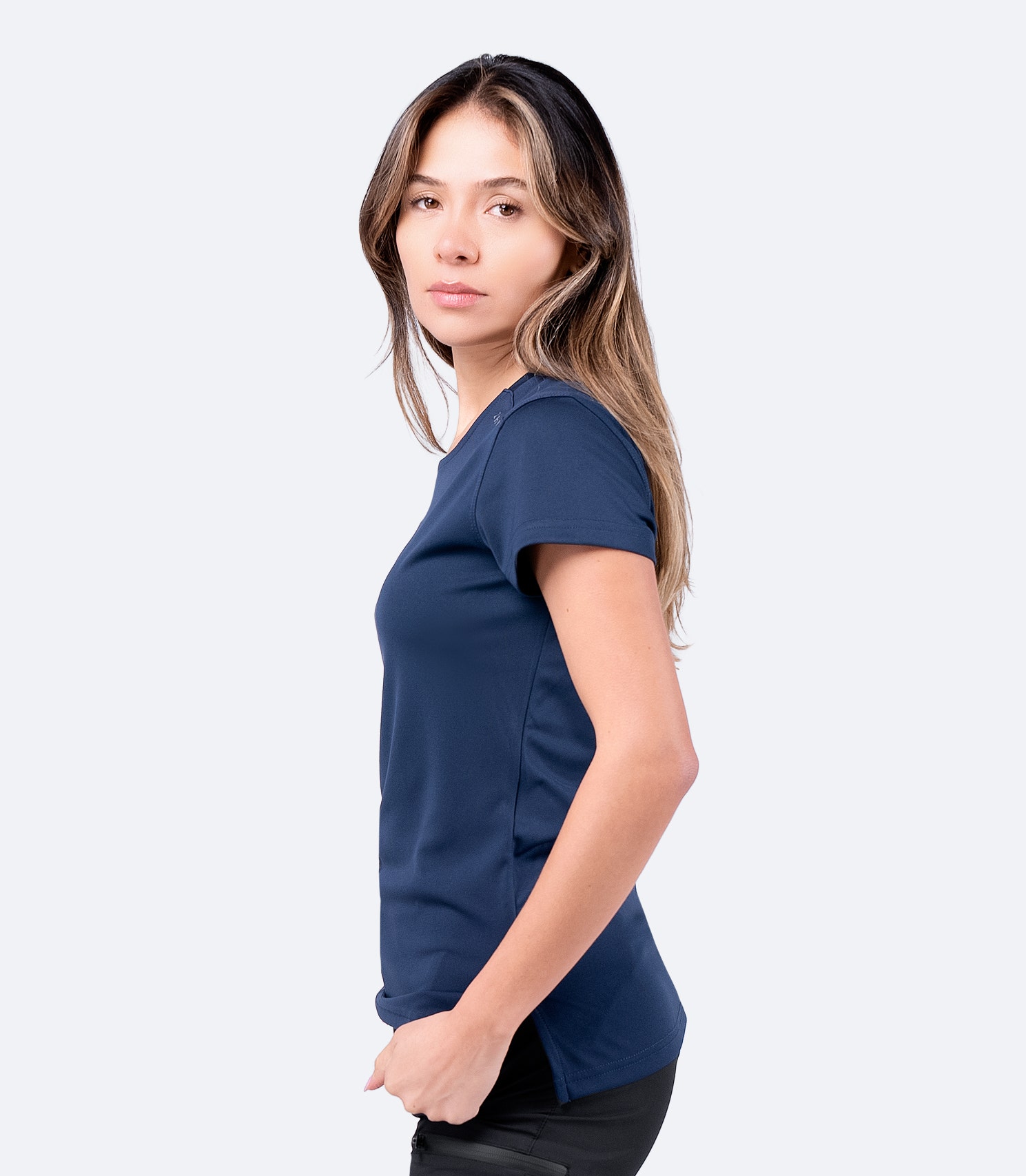 Side view of Zhik Women's UVActive Short Sleeve Top in navy, highlighting tapered fit and anti-static fabric.