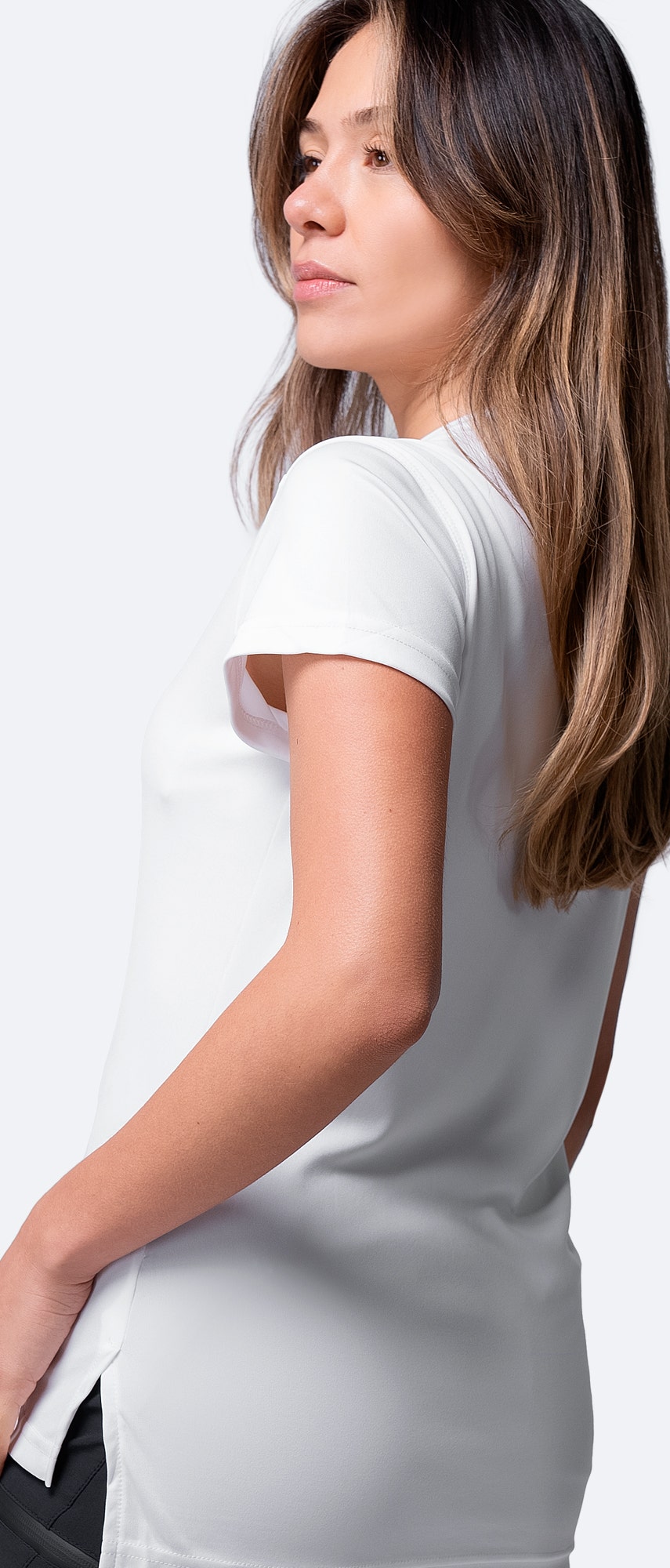 Detailed back view of white Zhik Women's UVActive Short Sleeve Top, showing lightweight construction and moisture control.