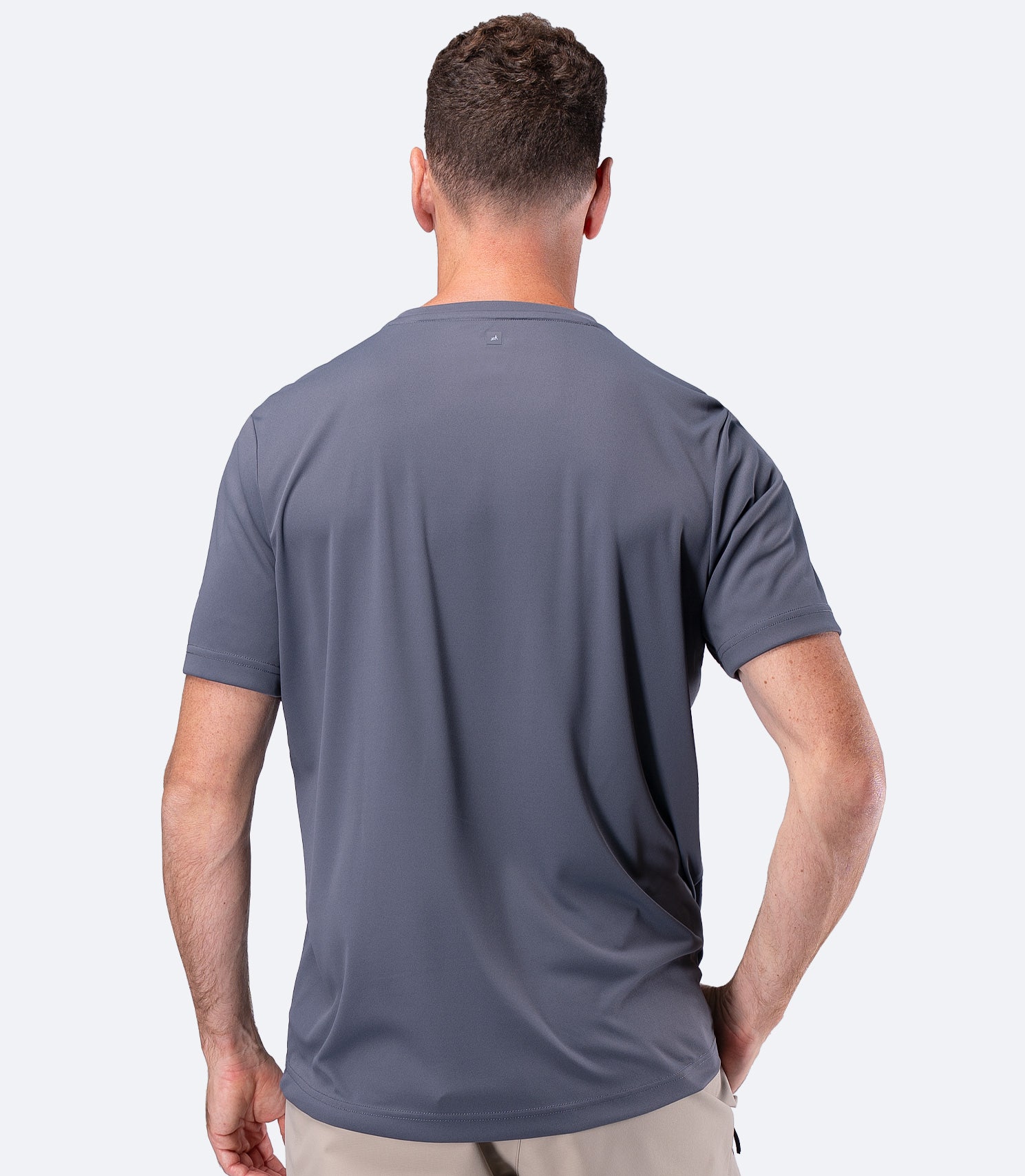Rear view of Zhik Men's UVActive Short Sleeve Tech Tee in Slate with smooth snag-resistant back