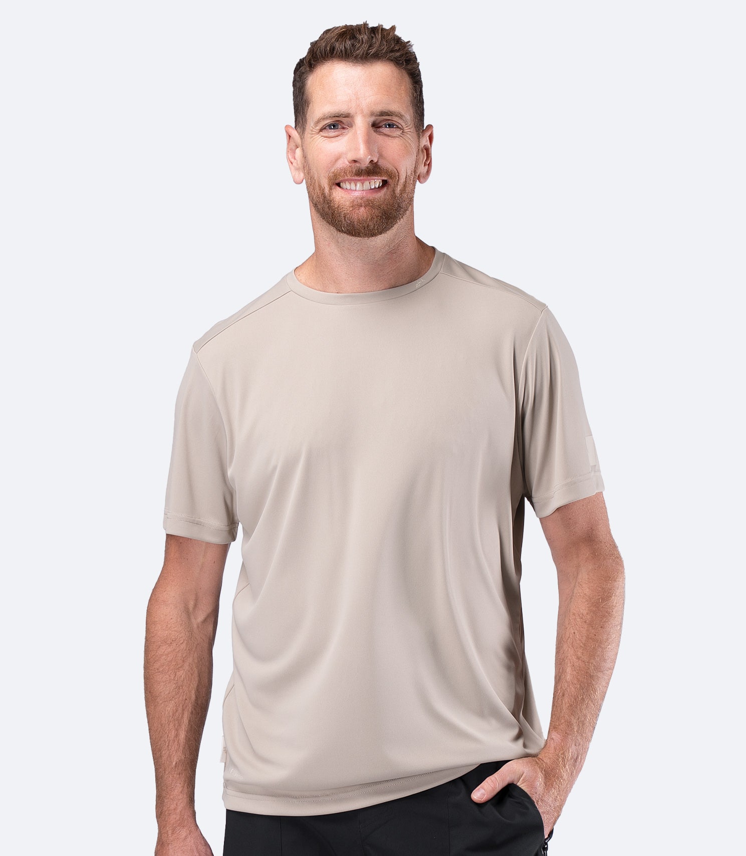 Front view of Zhik Men's UVActive Short Sleeve Tech Tee in Stone with clean chest for team logos