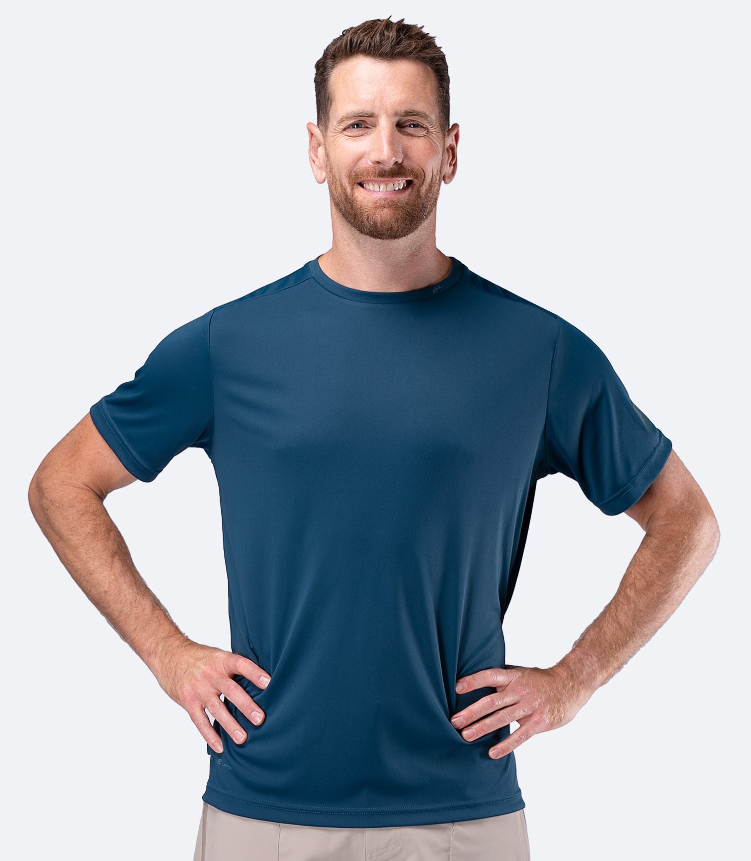 Front view of Zhik Men's UVActive Short Sleeve Tech Tee in Deep Teal with clean chest for team logos