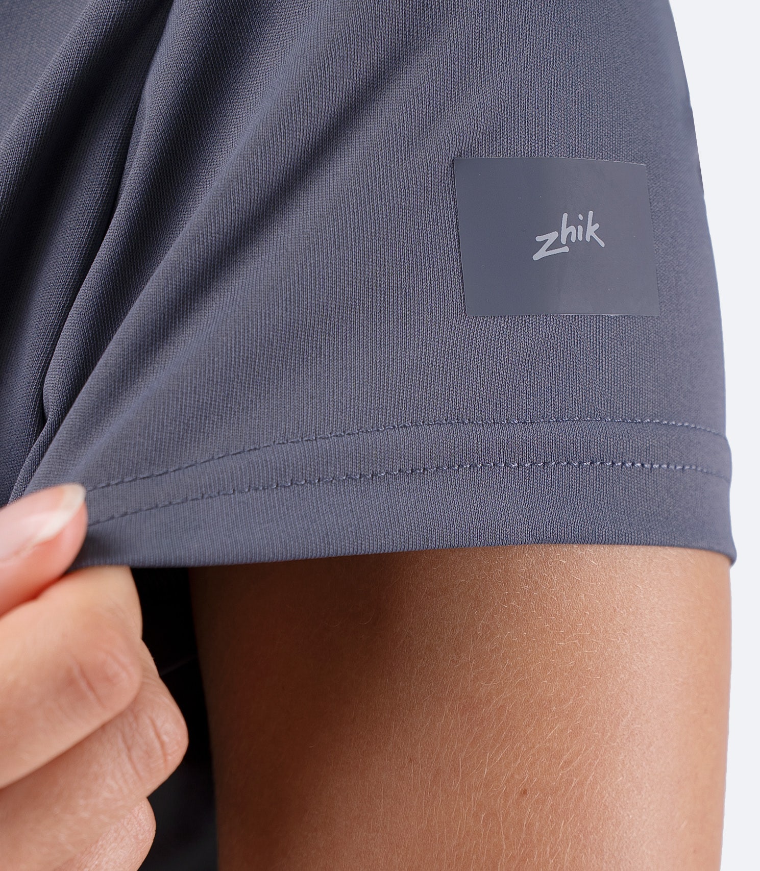 Closeup of shoulder Zhik logo on Women's UVActive short sleeve tech tee in Slate