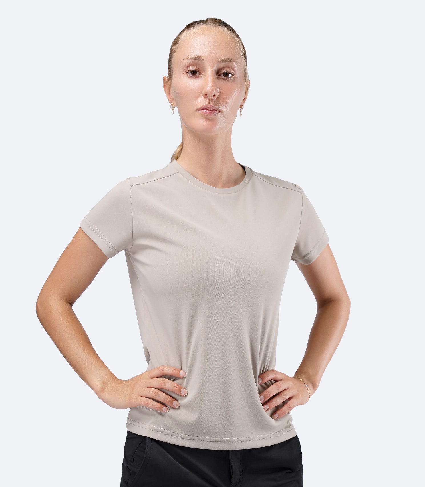 Zhik Women's UVActive short sleeve tech tee in Stone, front view showing UPF50+ sun protection in recycled polyester