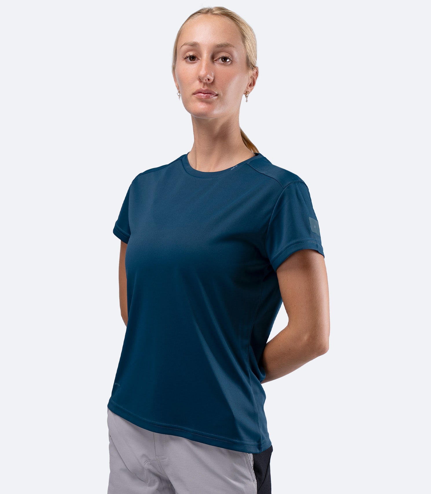 Zhik Women's UVActive short sleeve tech tee in Deep Teal, front view showing UPF50+ sun protection in recycled polyester