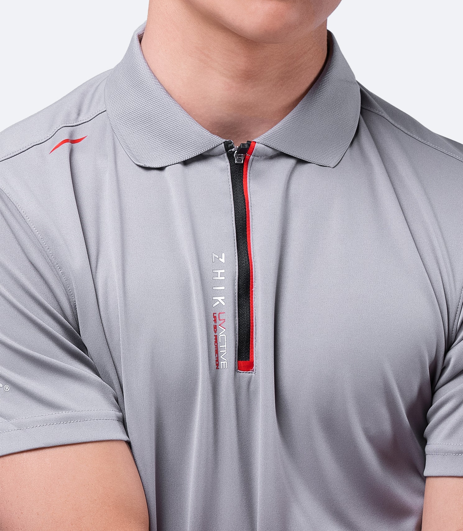 Close-up of grey Zhik Men's UVactive Zip Sports Polo, featuring soft, high-gauge polyester fabric and smooth collar design.