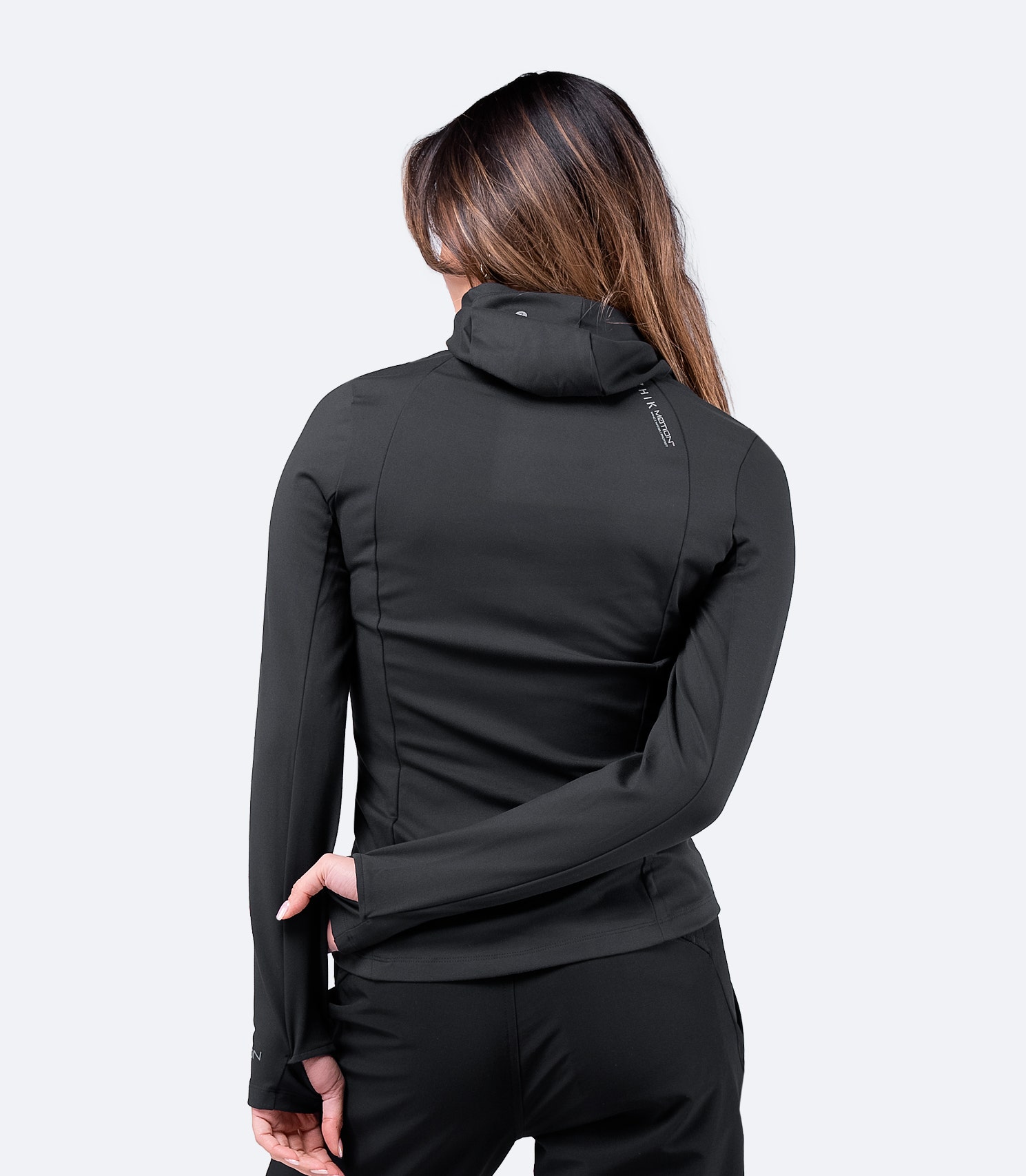 Back view of Women's Black ZhikMotion™ Hooded Top with abrasion-resistant outer, shaped fit for movement, and breathable material.