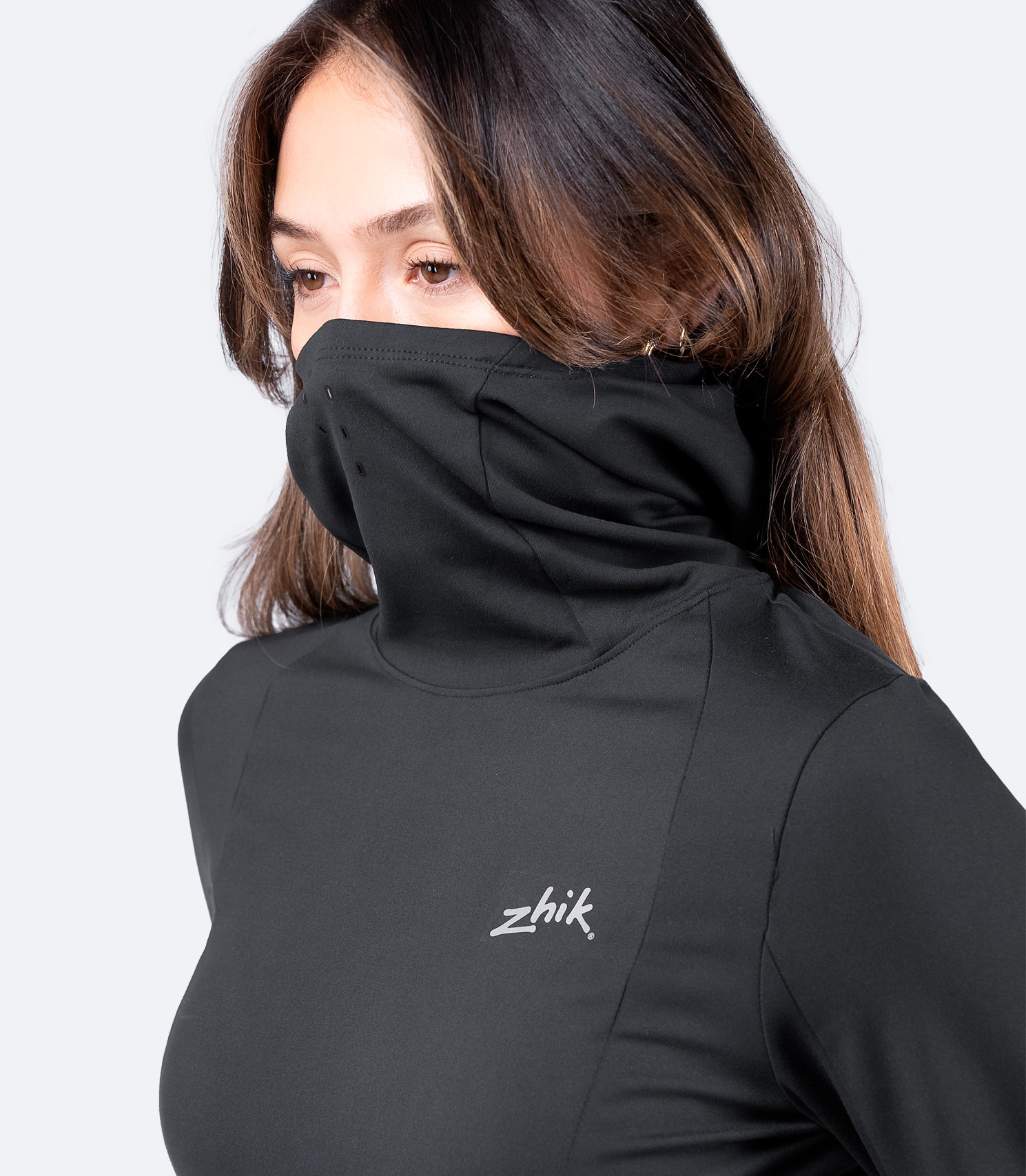Women's Black ZhikMotion™ Hooded Top with built-in balaclava covering mouth, offering wind protection and high-stretch fabric for movement.