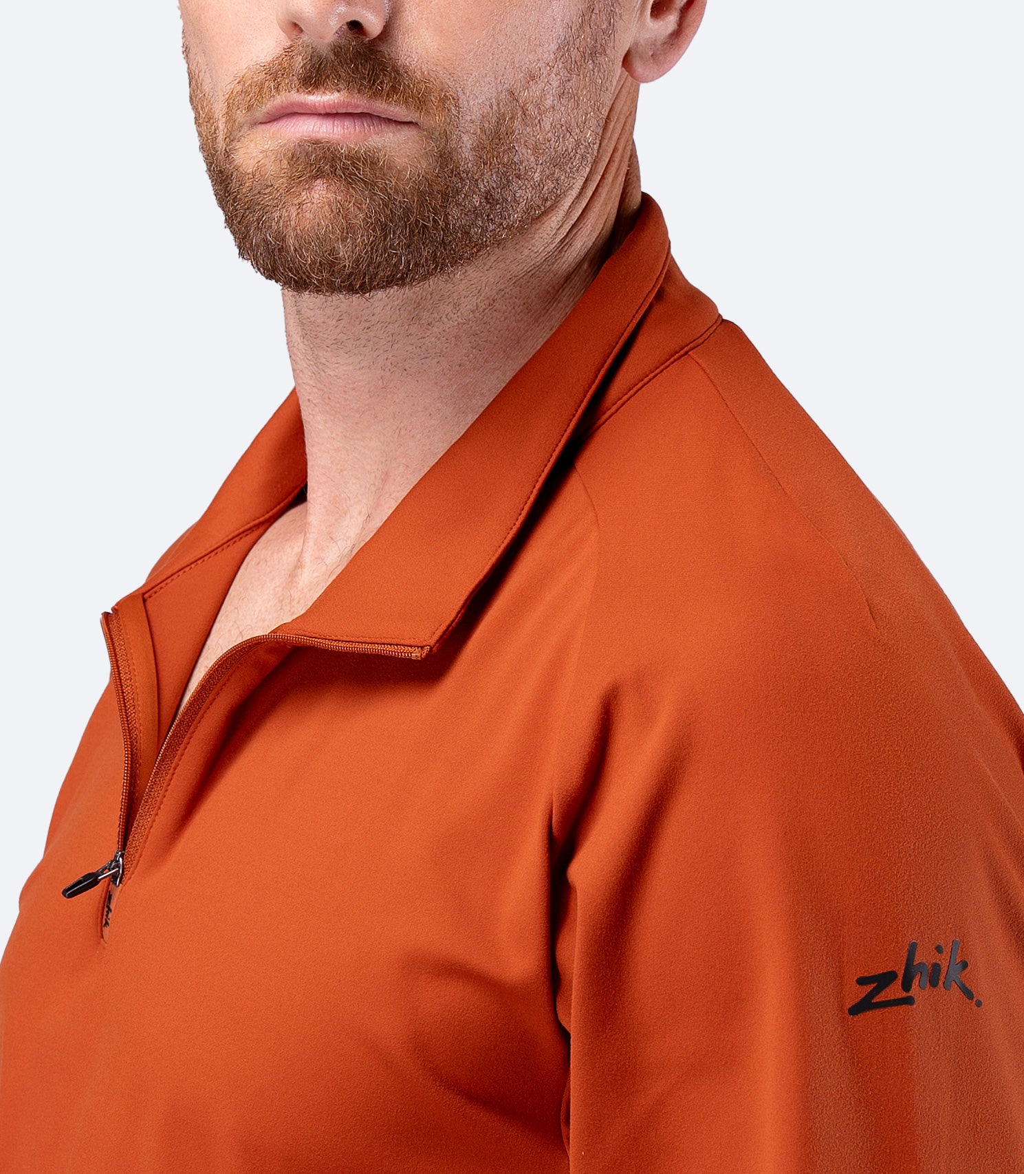 Close up of collar on Zhik Men's ZhikMotion 1/4 Zip Top in Red Earth, showing stand up design for wind protection