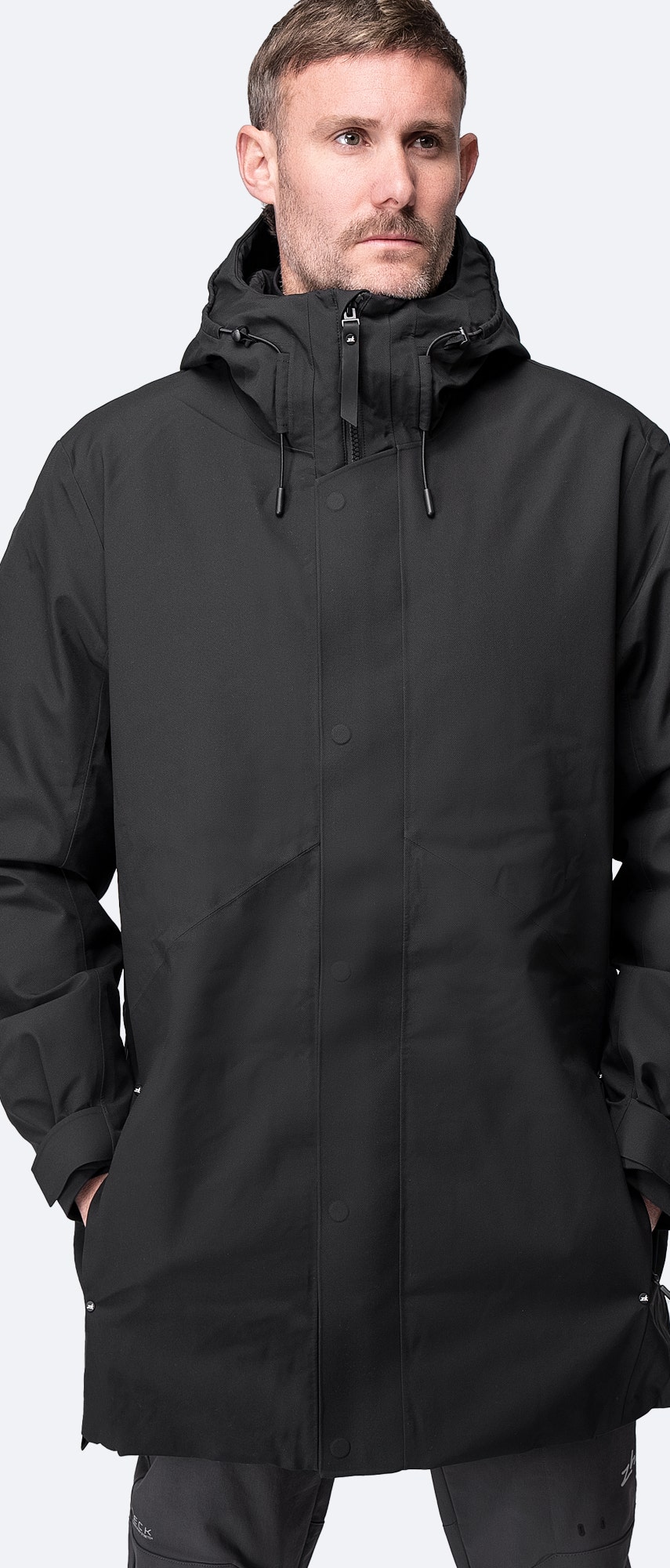Model wearing Zhik All Weather Coat, demonstrating its ergonomic fit and modern, rugged design.