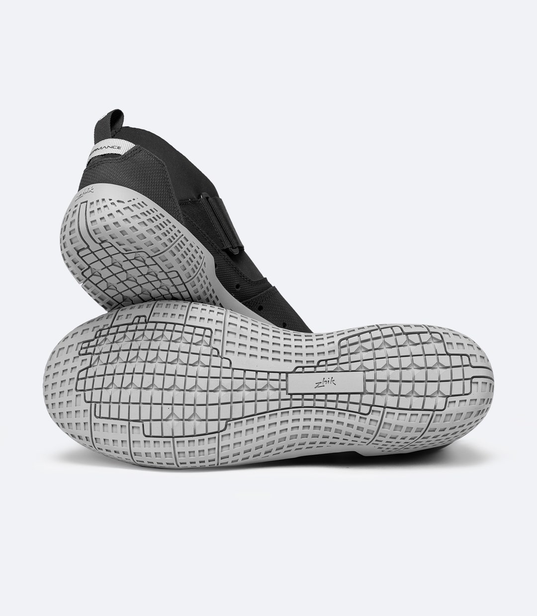 Pair of Zhik Performance Ankle Boots in black, one stacked to show high-walled outsole and abrasion protection