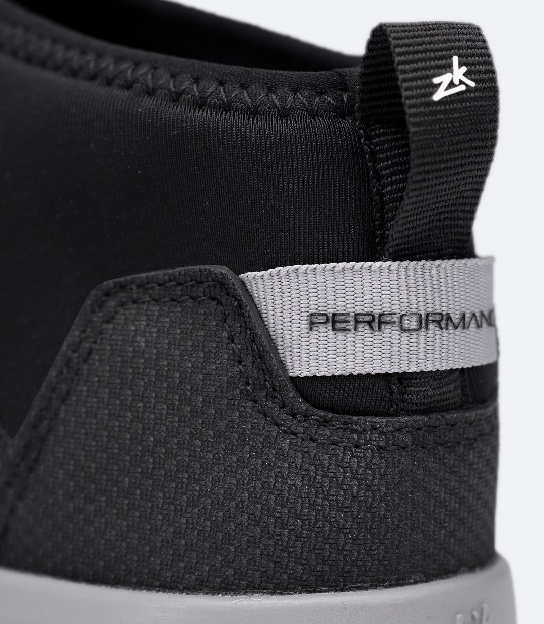 Close-up of rear Performance tag and heel loop on Zhik Performance Ankle Boot in black for easy entry