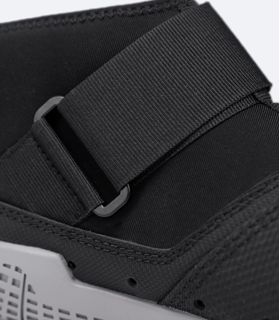 Front side close-up of black Zhik Performance Ankle Boot, showing wide Velcro ankle strap for a secure, adjustable fit