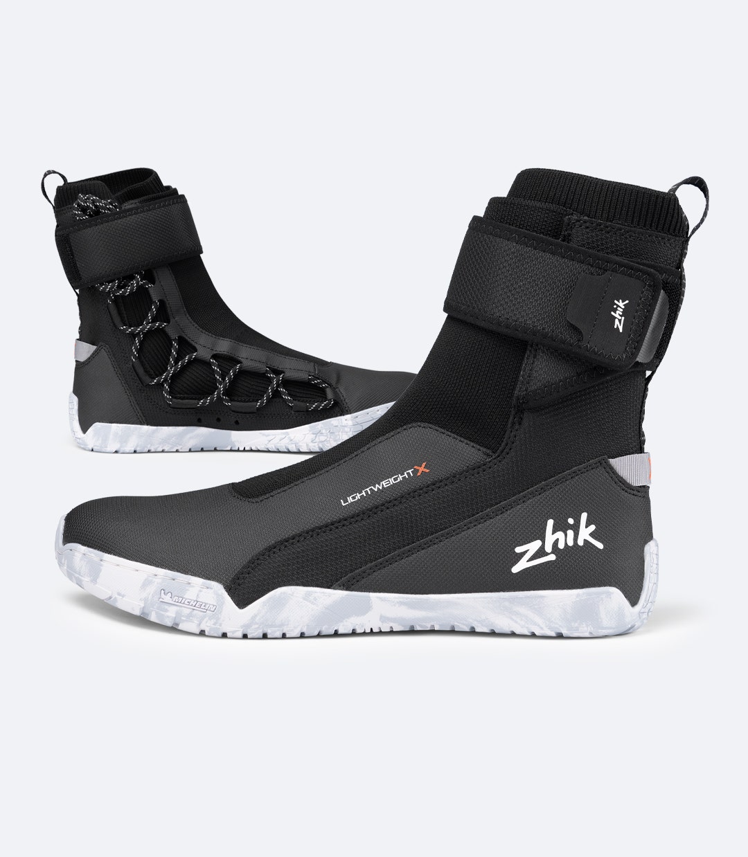 Two Zhik Lightweight High Cut X Boots in Black, side view showing 3D knit upper and high-grip Michelin outsole
