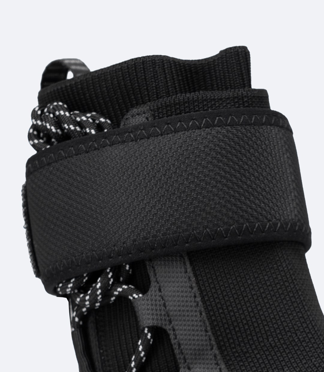 Close-up of Zhik Lightweight High Cut X Boot in Black showing low-profile ankle strap and supportive high-cut design.