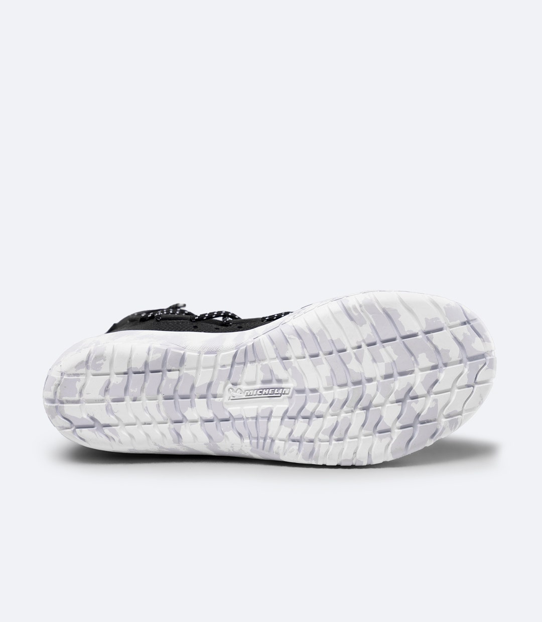 Sole view of black Zhik Hiking X Boot with Michelin outsole, deep water-channel tread and large grip lugs