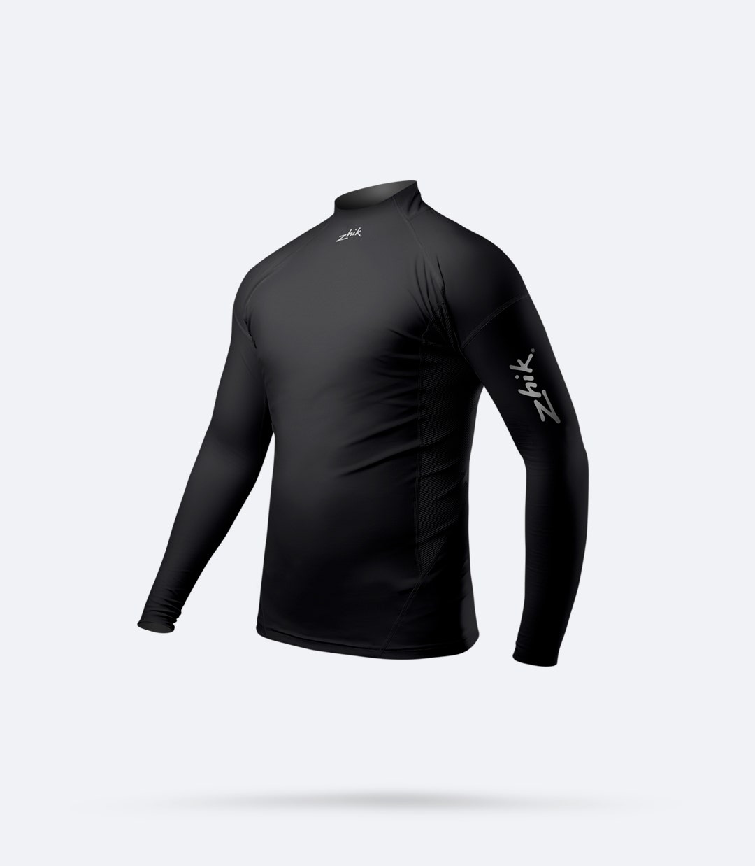 Side view of Zhik Junior Eco Spandex Long Sleeve Top in black, showing perforated side panels for breathability and 4-way stretch fabric.
