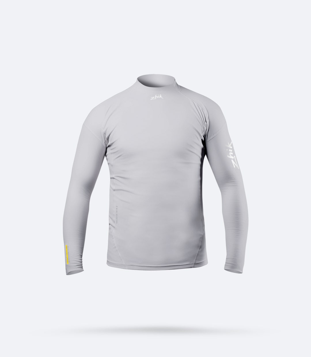Top de manga larga Zhik Junior Eco Spandex en platino, con nylon reciclado Repreve®, protección UPF 50+ y tejido de alta elasticidad.