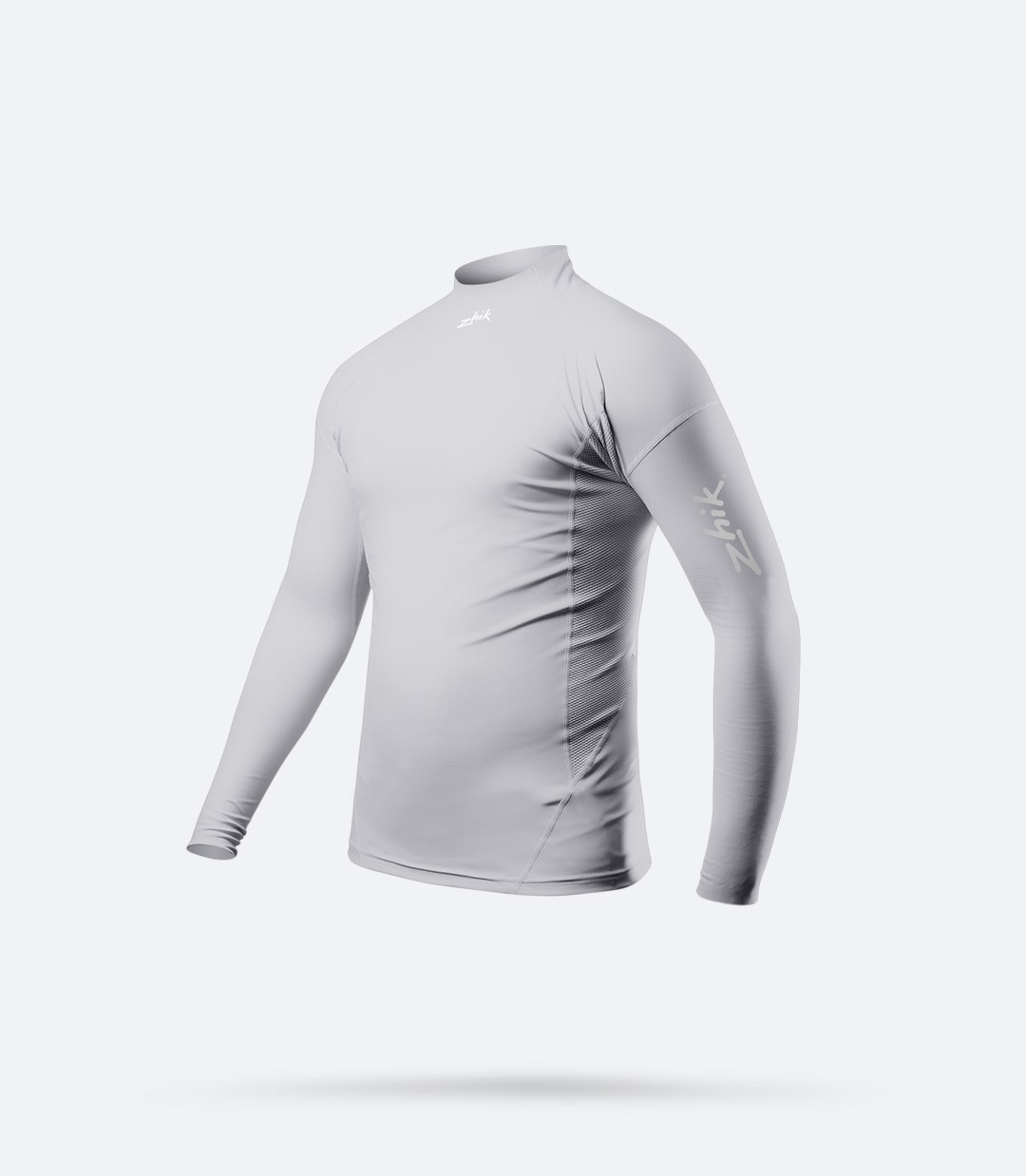 Vista lateral del Top de manga larga Zhik Junior Eco Spandex en platino, con paneles laterales perforados transpirables y tejido suave y refrescante.