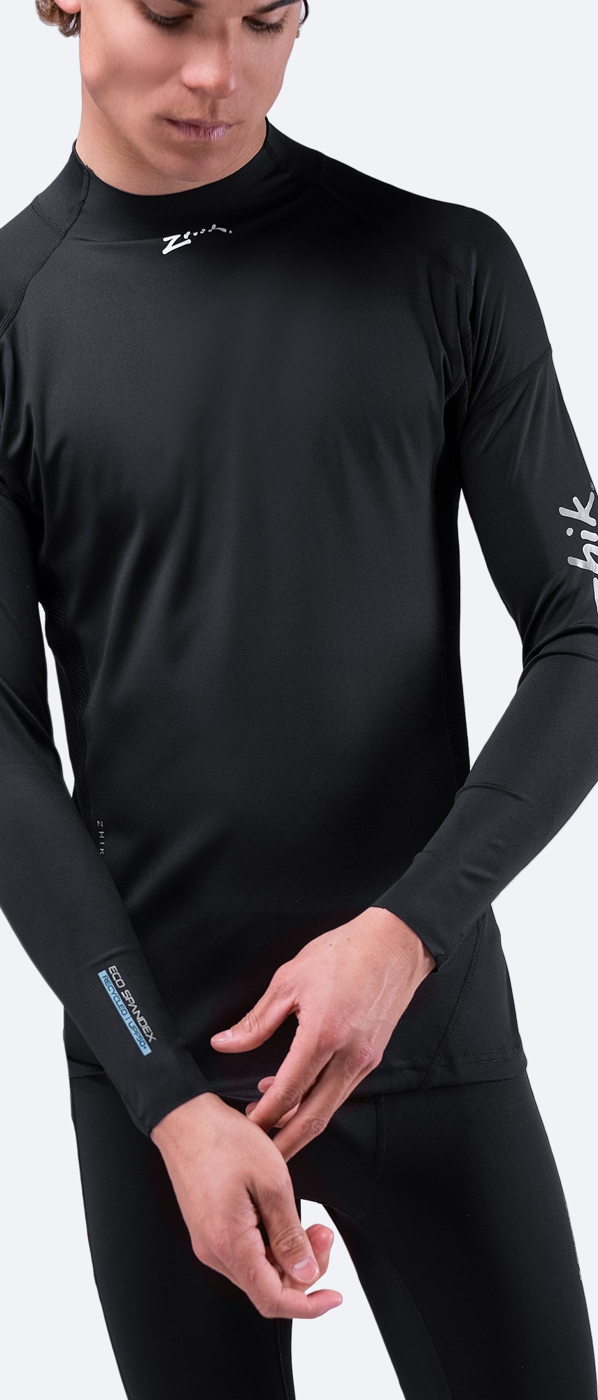 Close-up of Zhik Men's Black Eco Spandex Top sleeves, highlighting anti-rash flatlock stitching and durable 4-way stretch fabric.