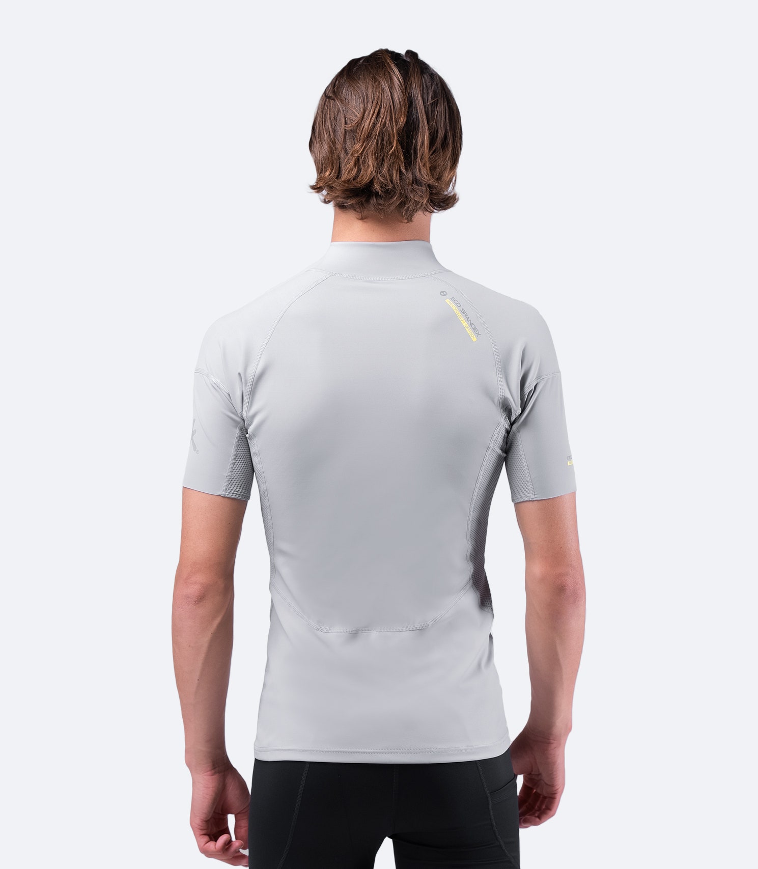 Back view of Zhik Men's Platinum Eco Spandex Top, showing perforated side panels for breathability and anti-rash flatlock seams.