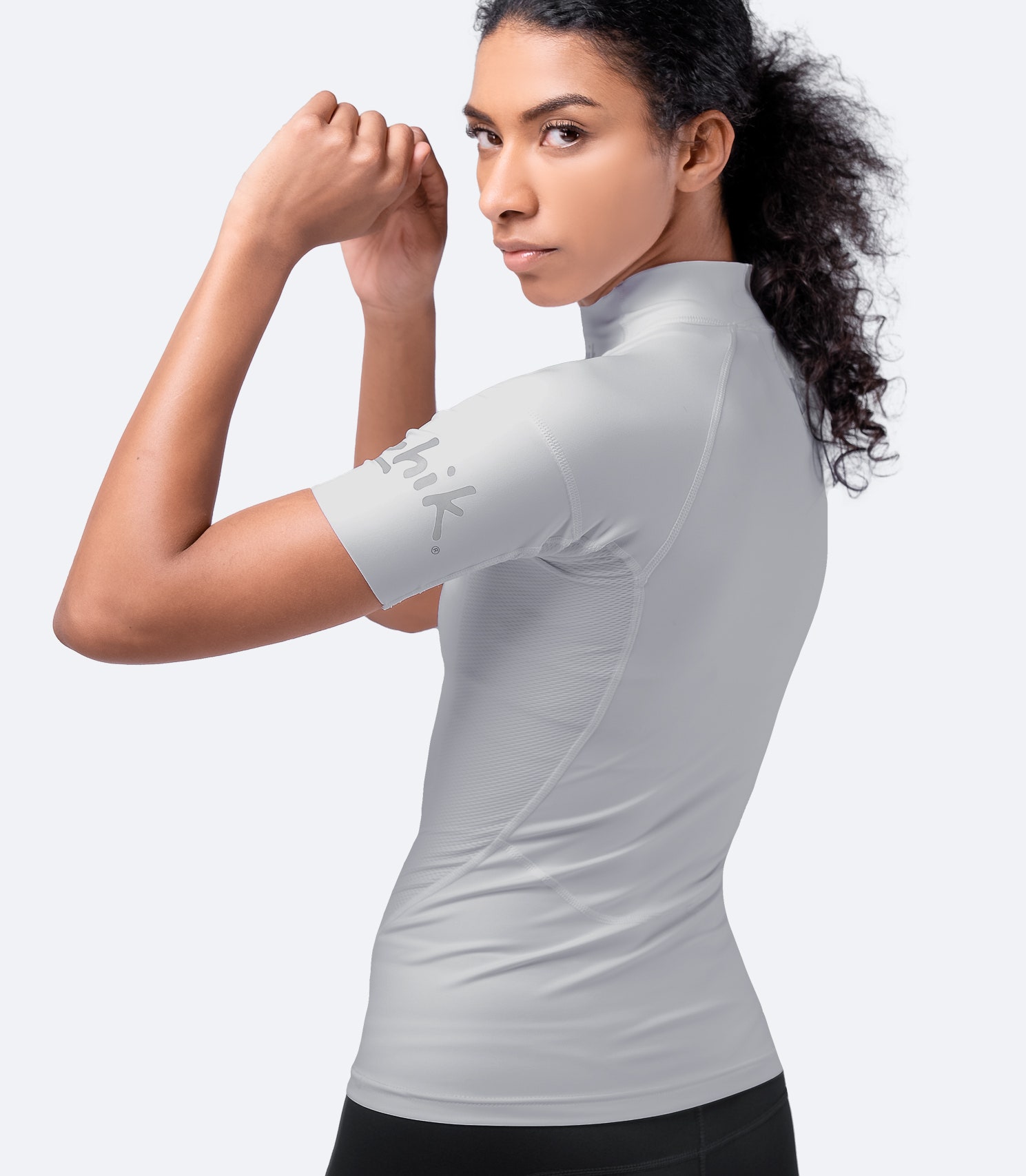 Side angle of Zhik Women's Platinum Eco Spandex Top in light gray, emphasizing 3D body panelling and lightweight, high-stretch fabric.