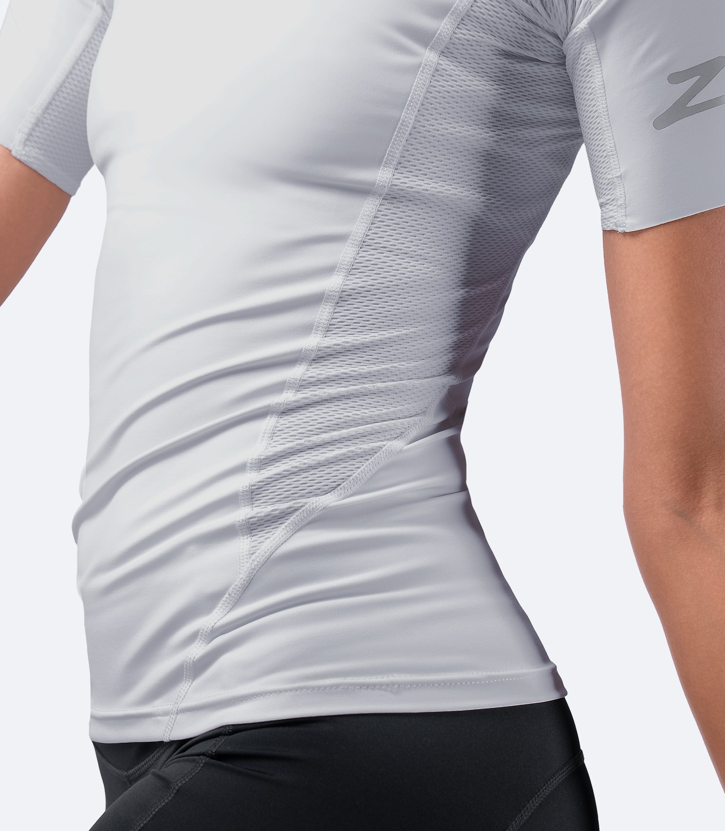 Detailed view of Platinum Eco Spandex Top near waistband, highlighting super soft, 4-way stretch recycled nylon fabric for flexibility.