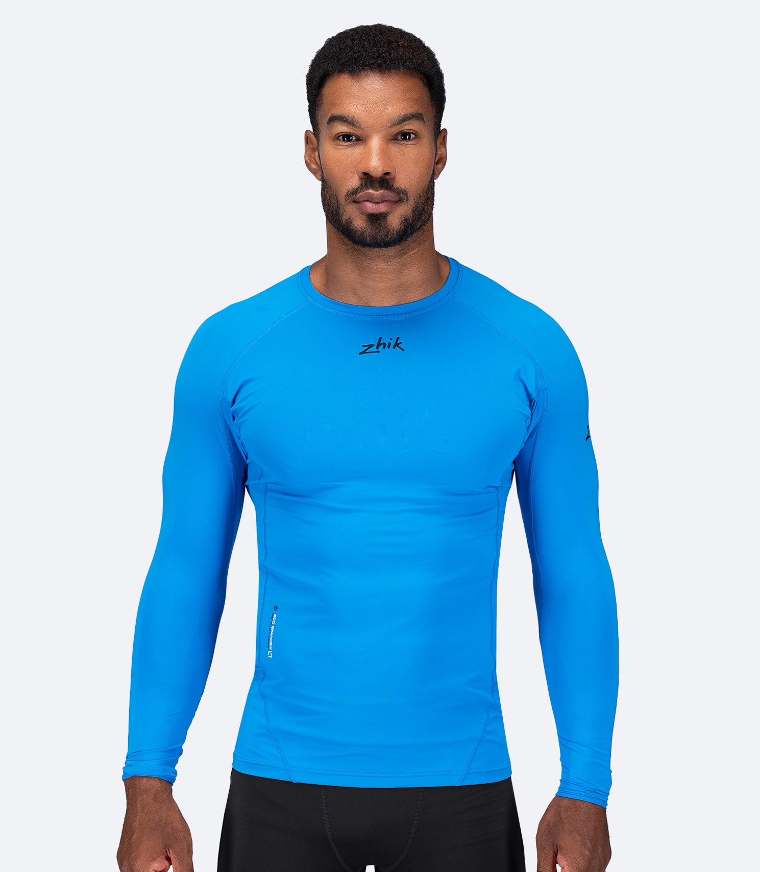 Zhik Men's Eco Spandex LT Long Sleeve Baselayer Top in Cyan, ultra-lightweight with 3D body mapped fit and UPF 50+ sun protection.