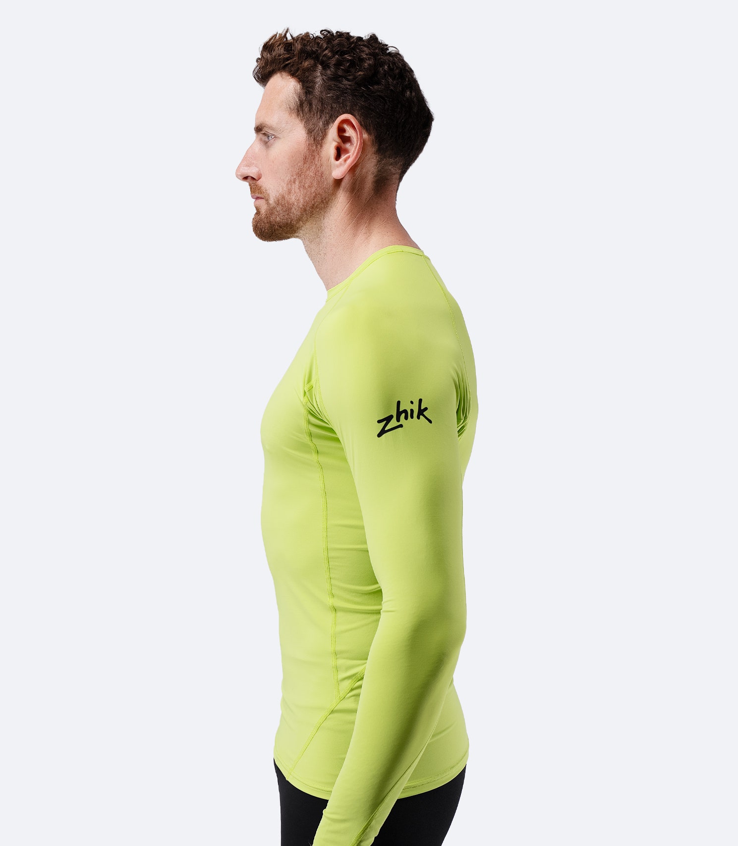 Side profile of Zhik Men’s Eco Spandex LT Long Sleeve Baselayer Top in lime