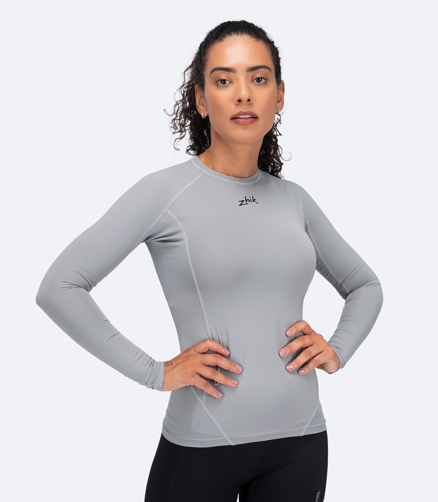 Zhik Women's Eco Spandex LT Long Sleeve Top in Platinum with breathable recycled fabric and UPF 50+ protection.
