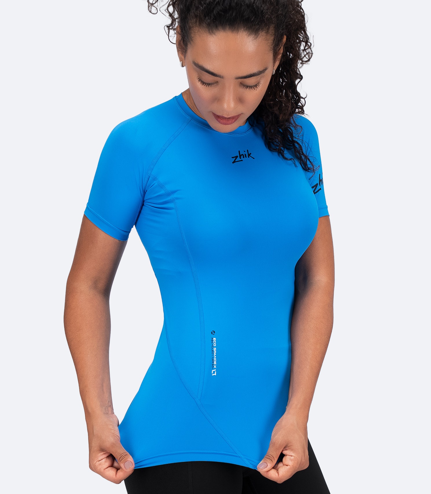 Side view of Cyan Zhik Women's Eco Spandex LT Top showing 4-way stretch fabric for unrestricted movement and breathable comfort.