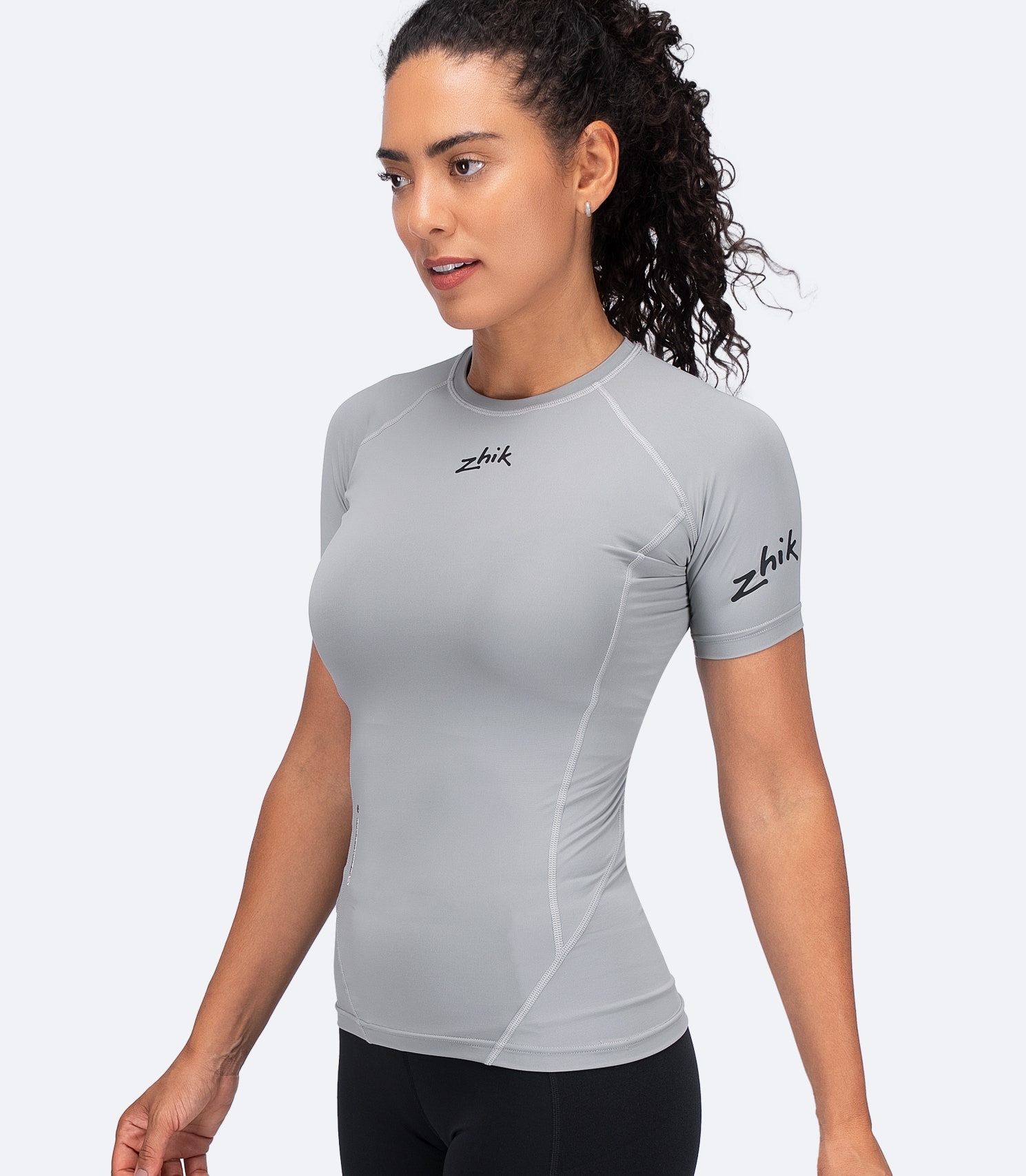 Zhik Women's Eco Spandex LT Baselayer Top in Platinum, front view showing lightweight fit with breathable, recycled fabric.