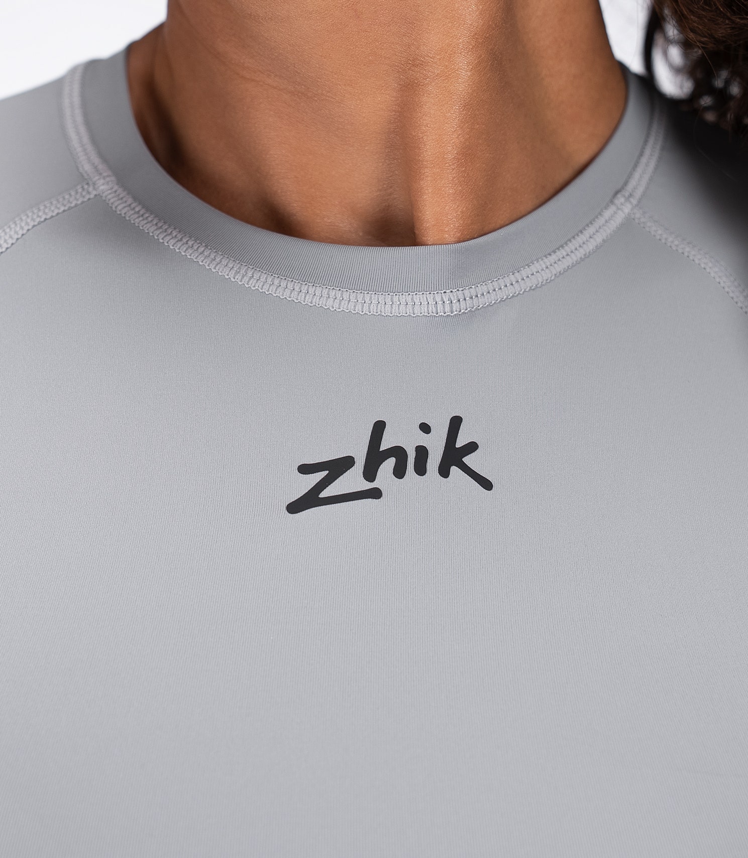 Collar closeup of Zhik Women's Eco Spandex LT Top in Platinum, showing comfort-focused neckline and ultralight material.
