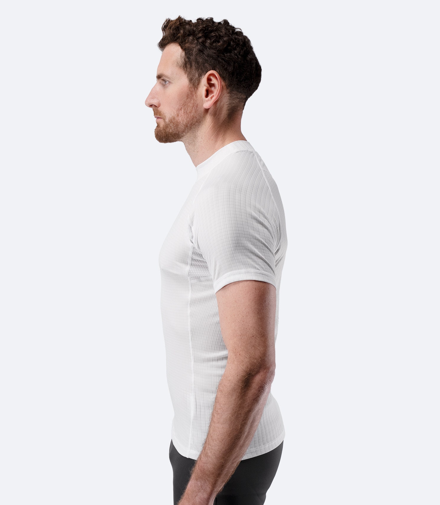 Side profile of Zhik Men’s Active Baselayer Top in white with athletic fit