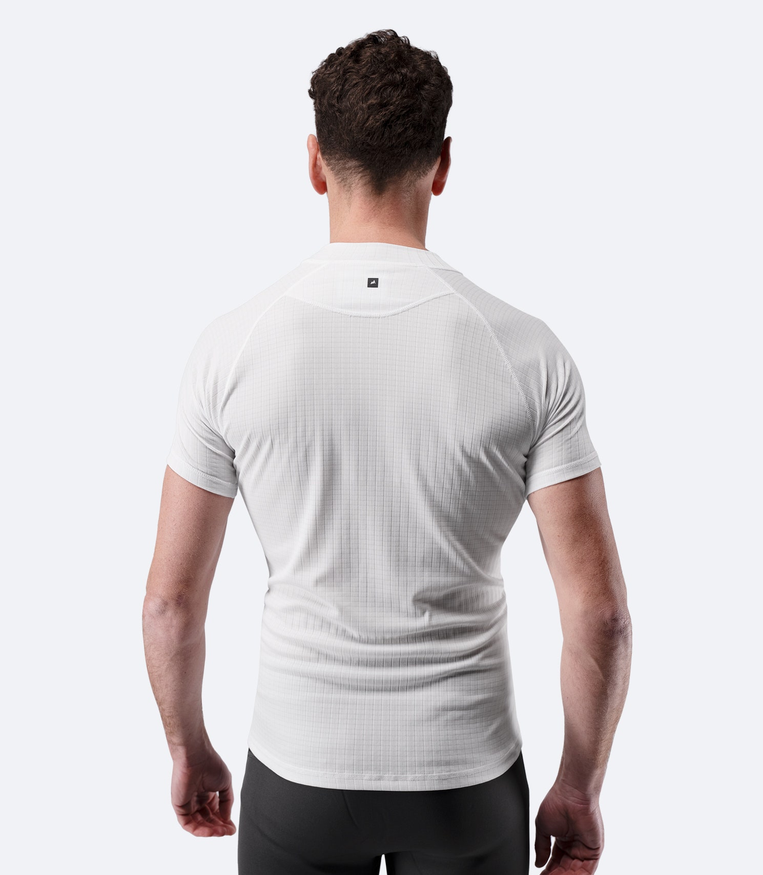 Back view of Zhik Men’s Active Baselayer Top in white with grid-knit texture