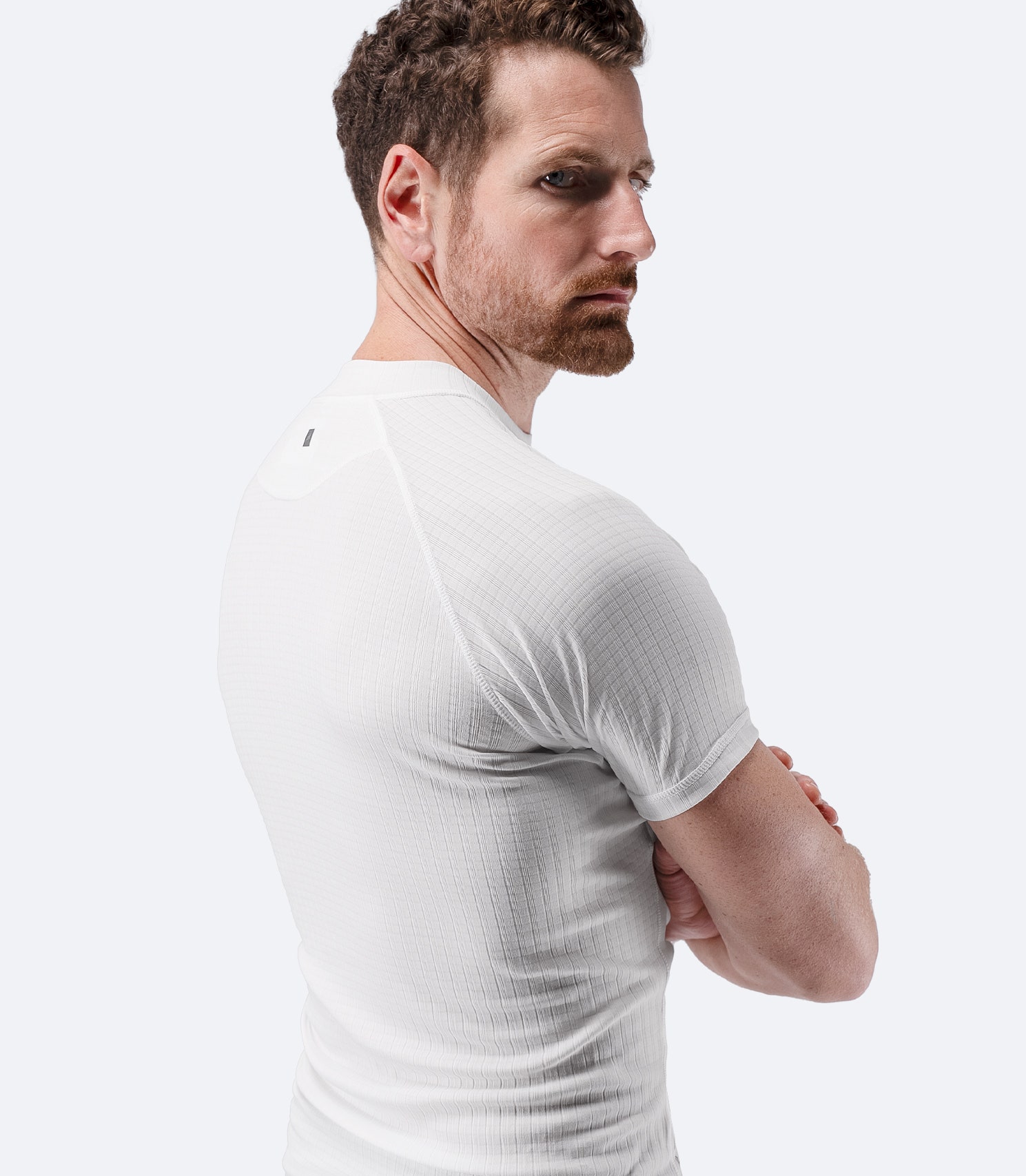 Three-quarter profile view of Zhik Men’s Active Baselayer Top in white