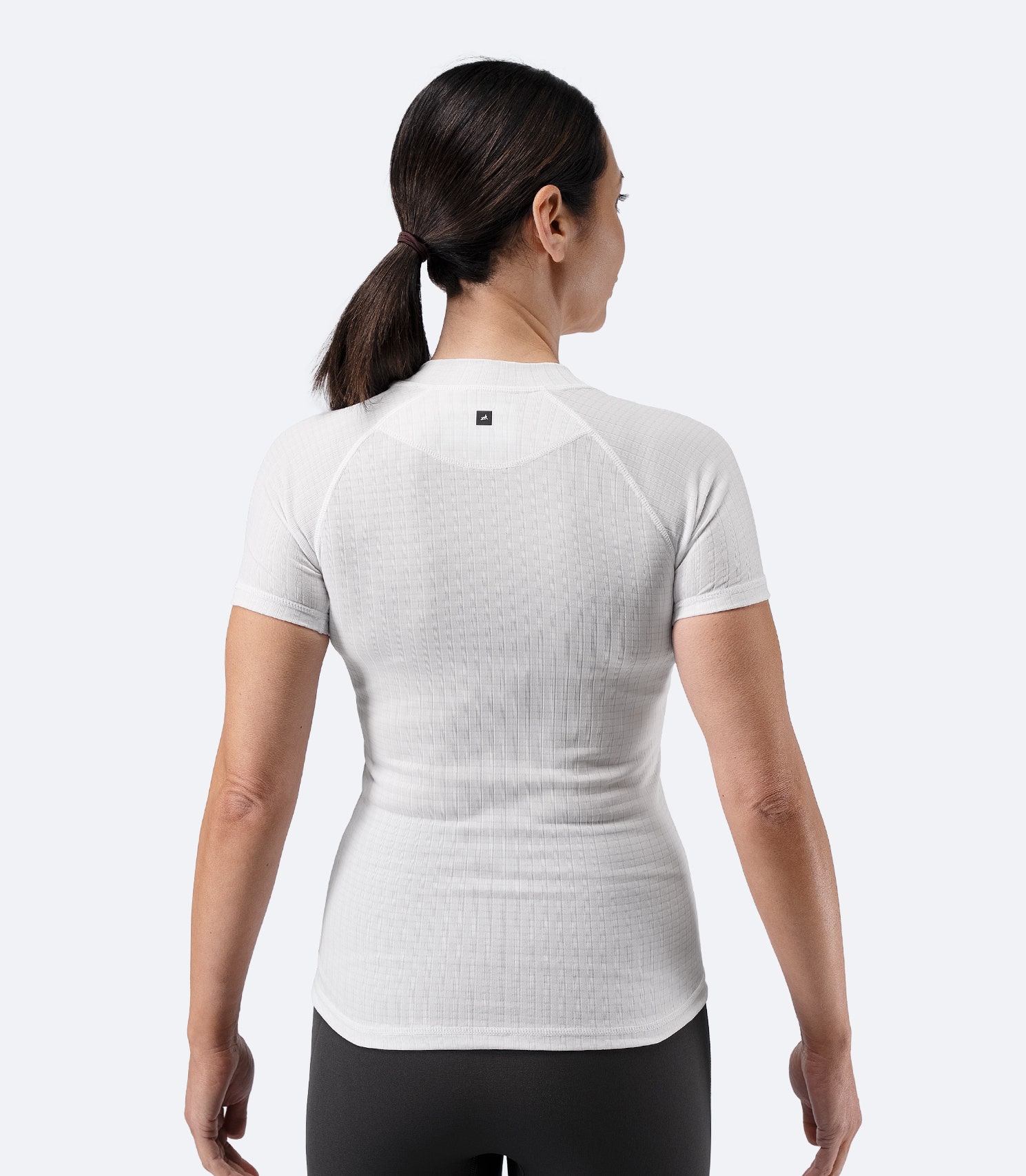 Back view of Zhik Women’s Active Baselayer Top in white with grid-knit texture