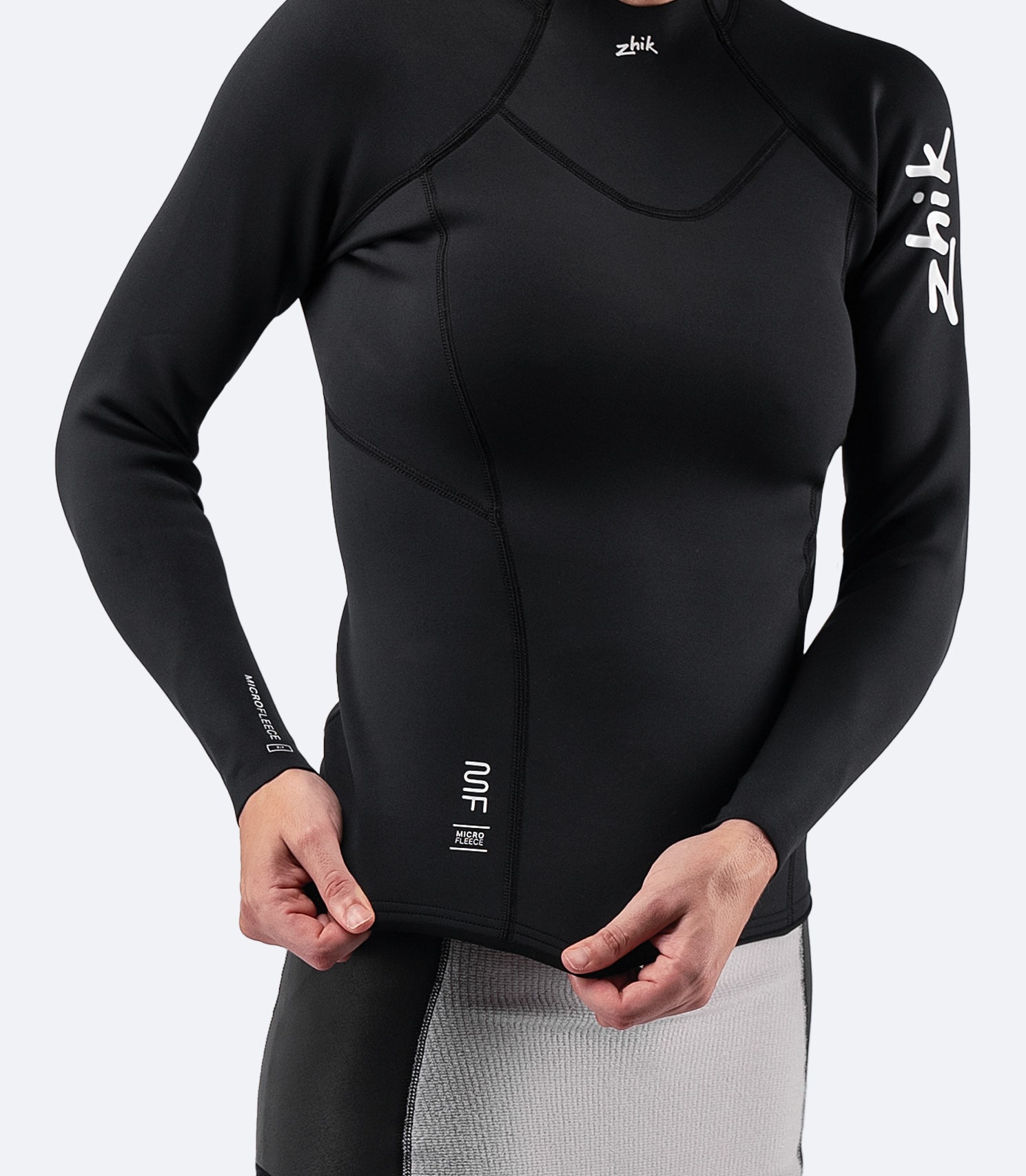 Close-up of Zhik Women's Microfleece Top showing the mid-height collar and soft, stretch fabric for a flexible fit.