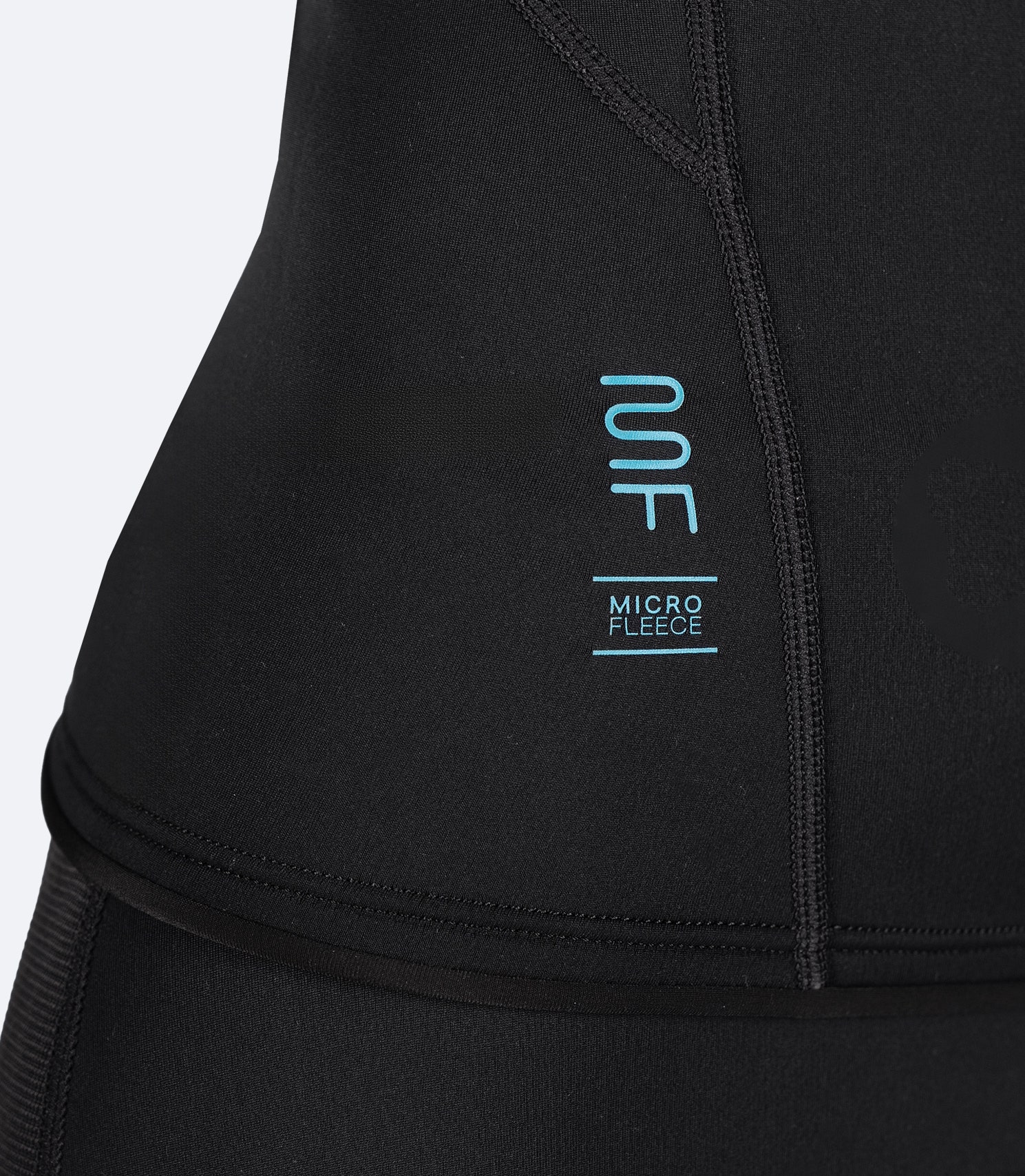 Close-up of Zhik Microfleece™ logo with detailed stitching, highlighting quality craftsmanship and branding on the Youth Microfleece Top
