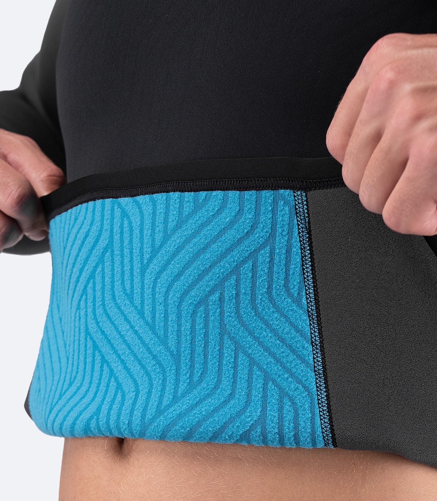 Close-up of Zhik Men's MicrofleeceX Top fabric, showing the heat-retaining graphene-infused lining and sustainable Yulex® foam construction.