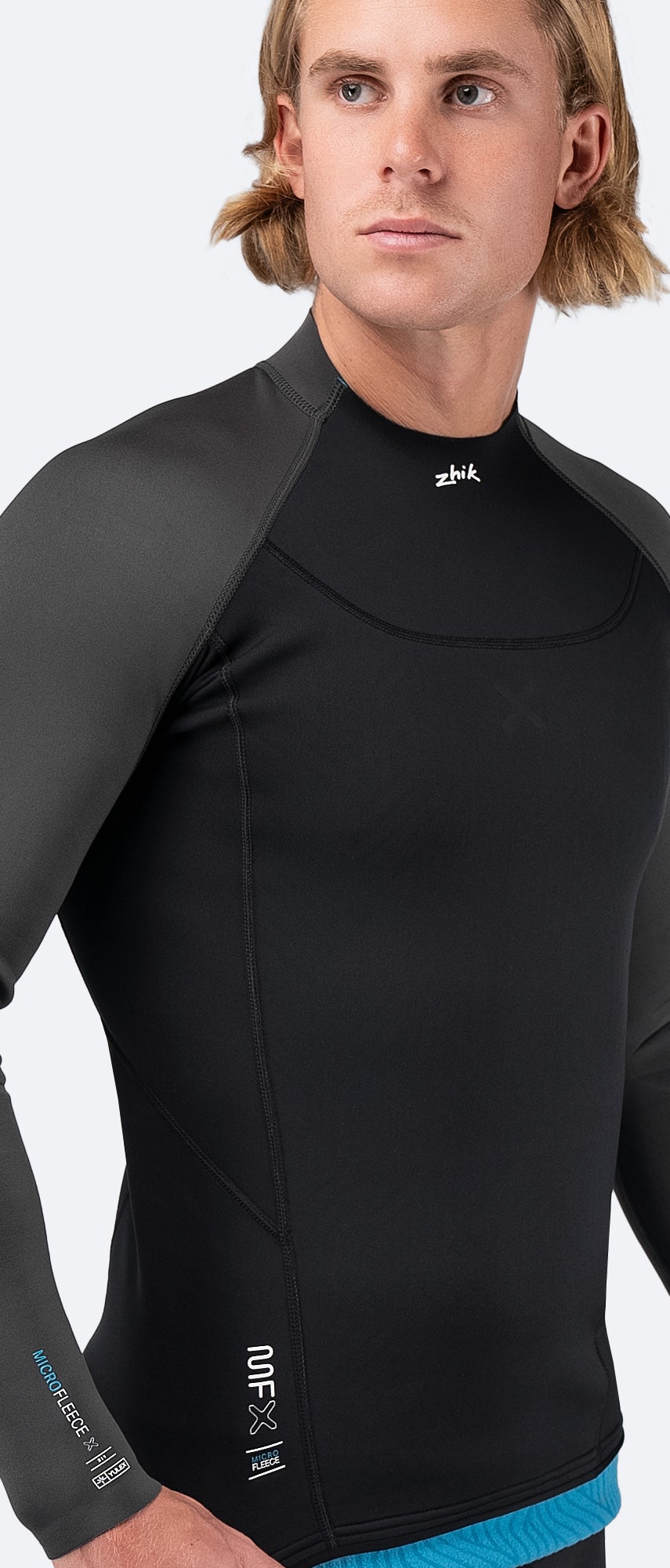 Front view of Zhik Men's MicrofleeceX Top, highlighting the mid-profile collar and shaped raw front for comfort.