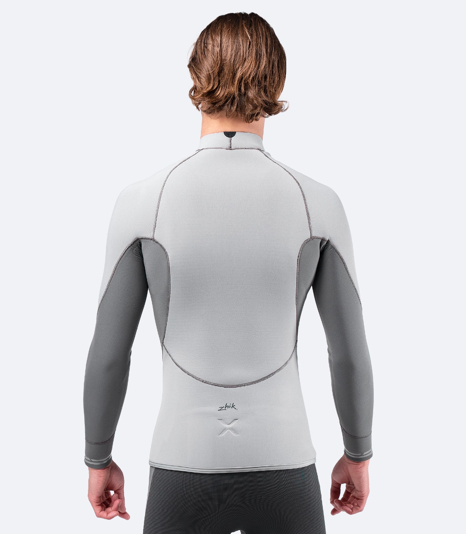 Back view of Zhik Men's Superwarm X Top in grey, highlighting water-resistant nylon outer and glued, blind-stitched seams for durability.