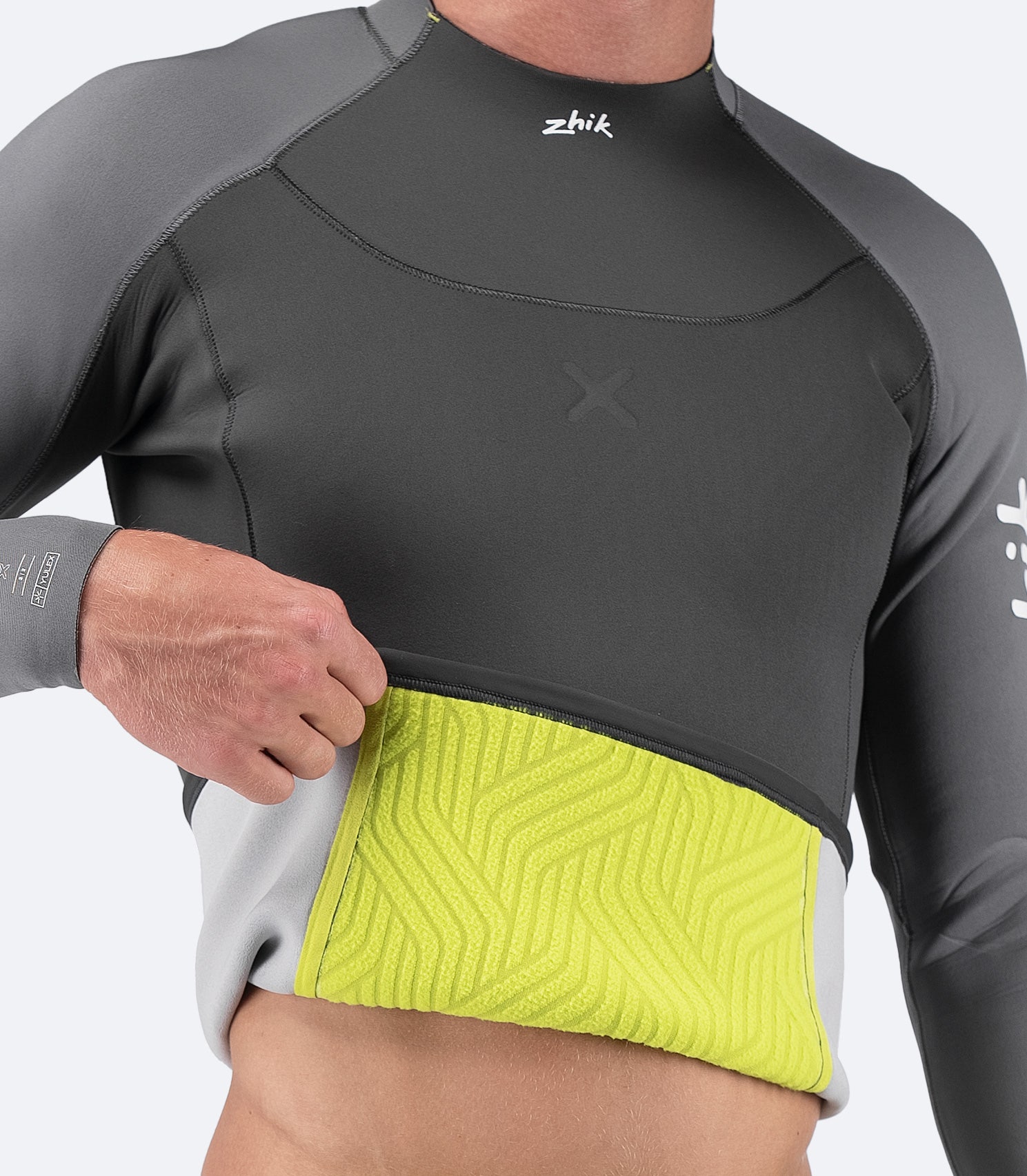 Interior view of Zhik SuperwarmX wetsuit top, showcasing fleece-lined insulation and smooth, flexible fabric for warmth and comfort