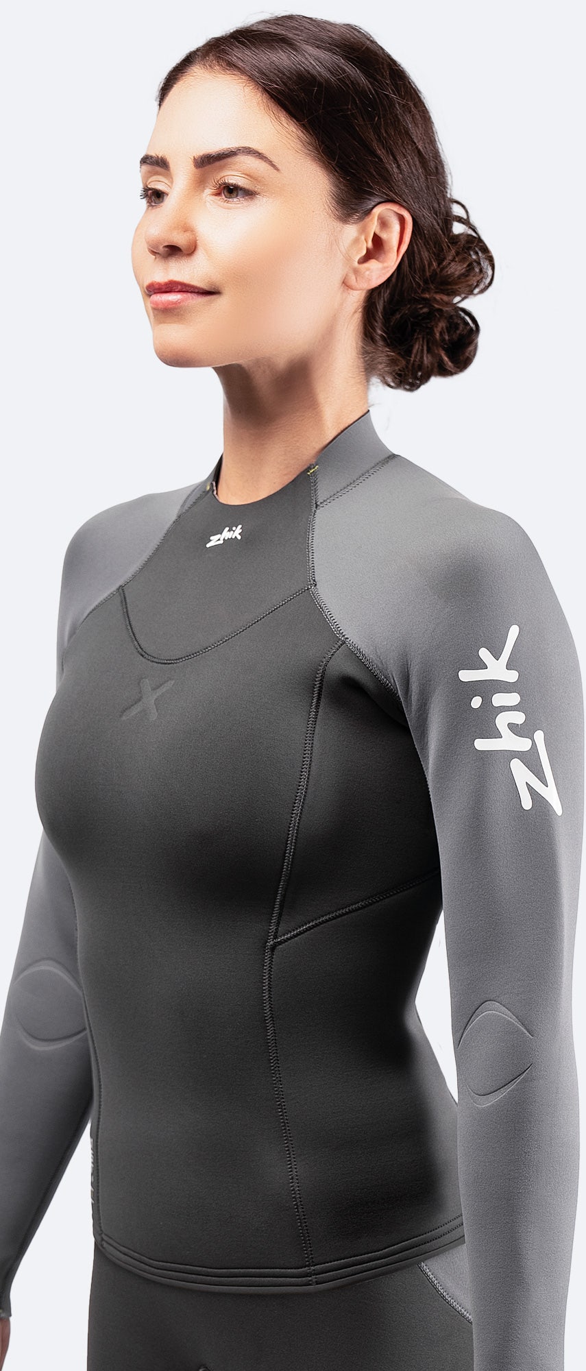 Side view of Zhik Women's SuperwarmX Top in grey, showing the ergonomic, performance-focused fit.
