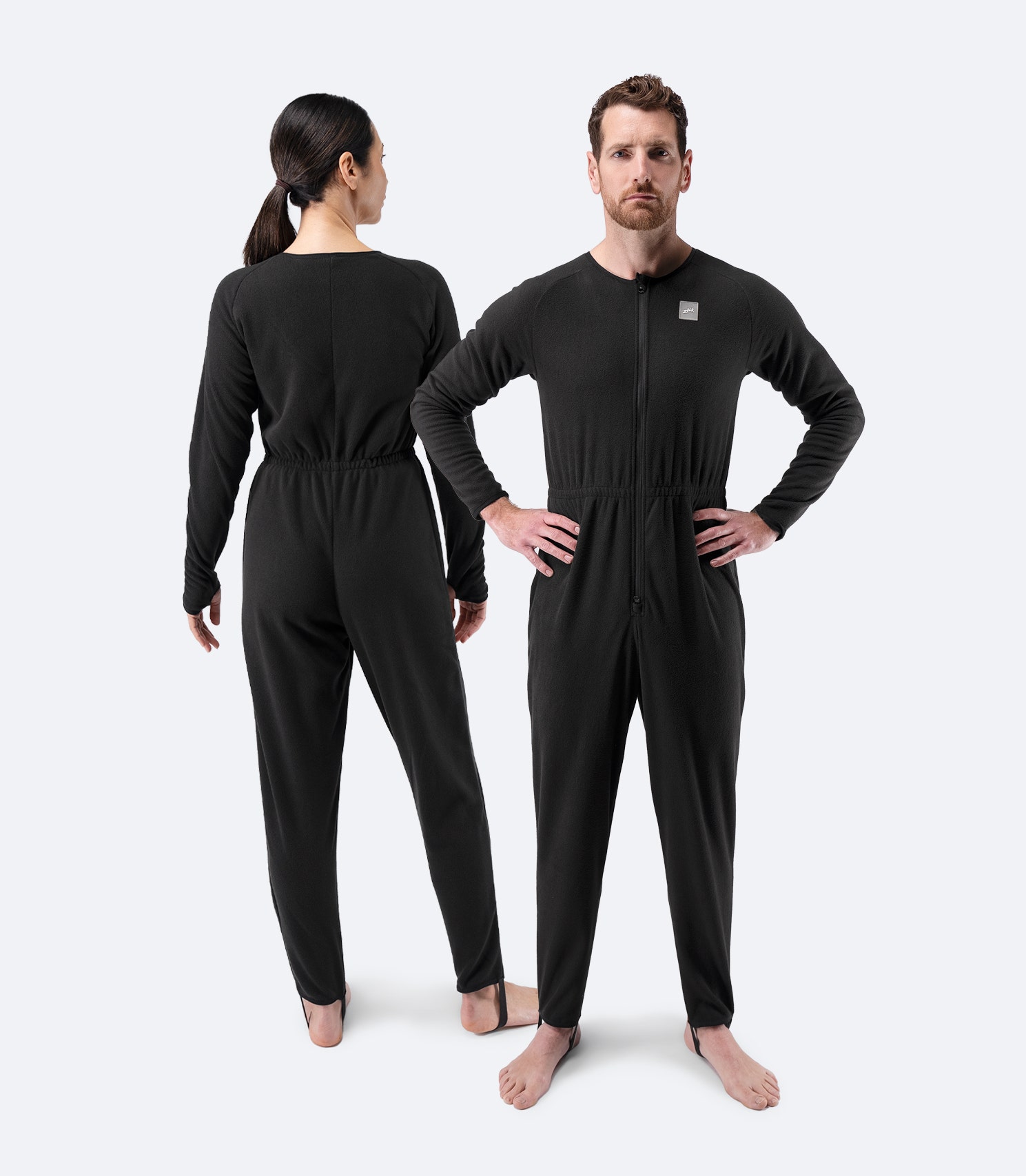 Front and back view of Zhik Drysuit Underfleece in black, full-length design