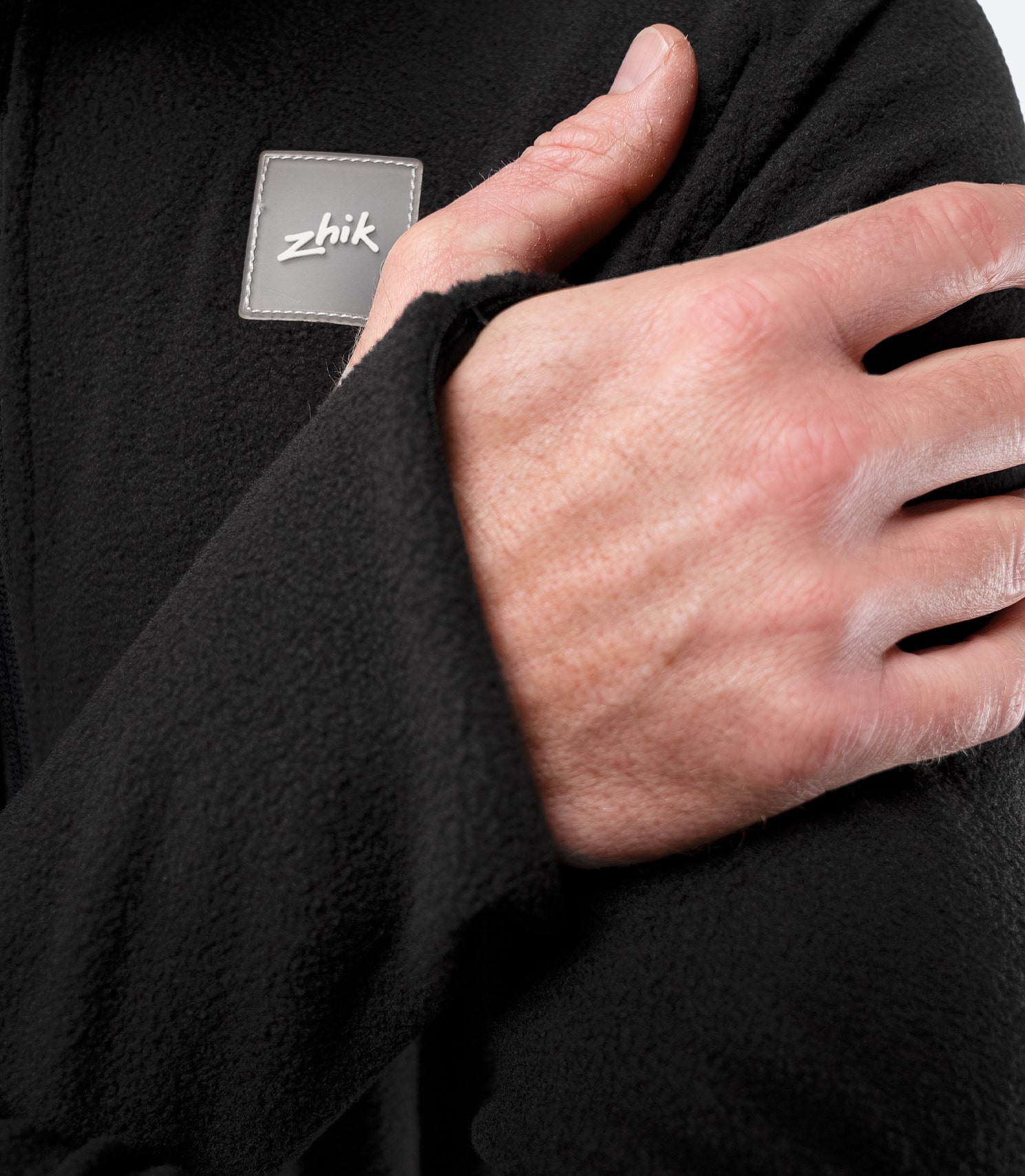 Close-up of Zhik logo patch on chest of Drysuit Underfleece