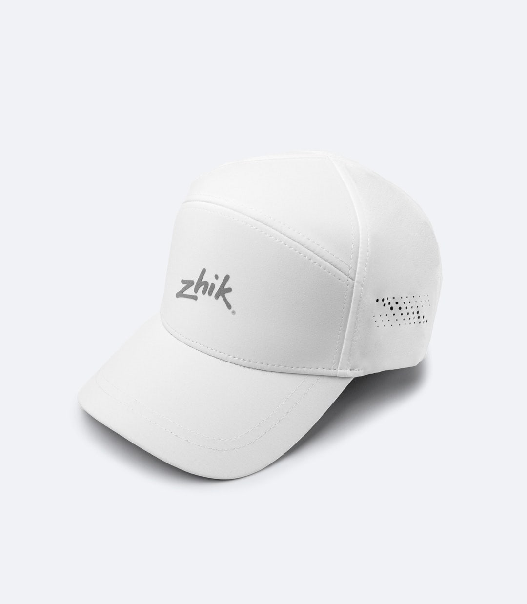 Zhik Sports Cap in white, featuring lightweight, quick-dry fabric with laser-cut ventilation and an anti-glare brim for performance on and off the water.
